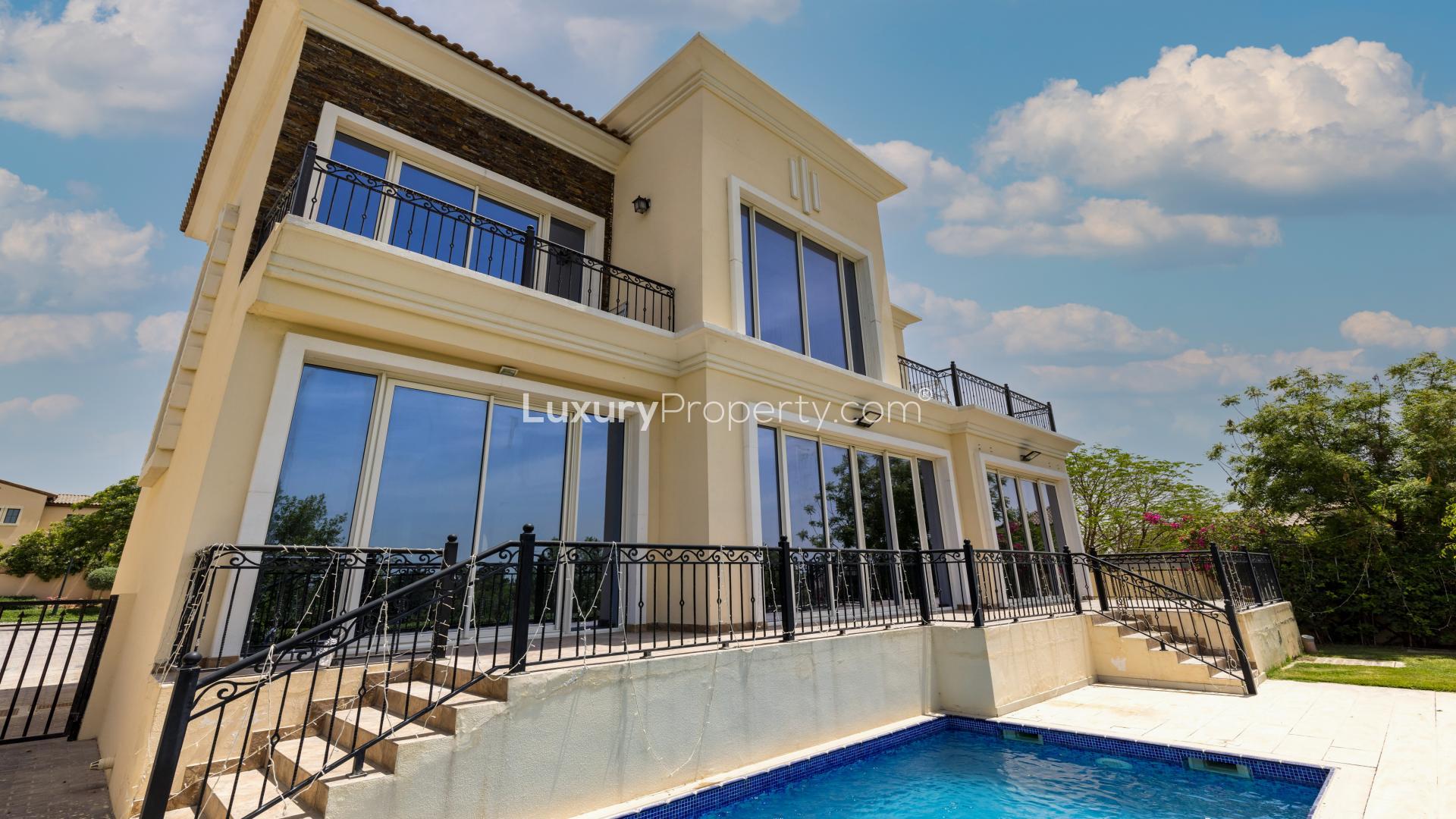 Spacious living area in JGE villa with large windows and scenic views for rent
