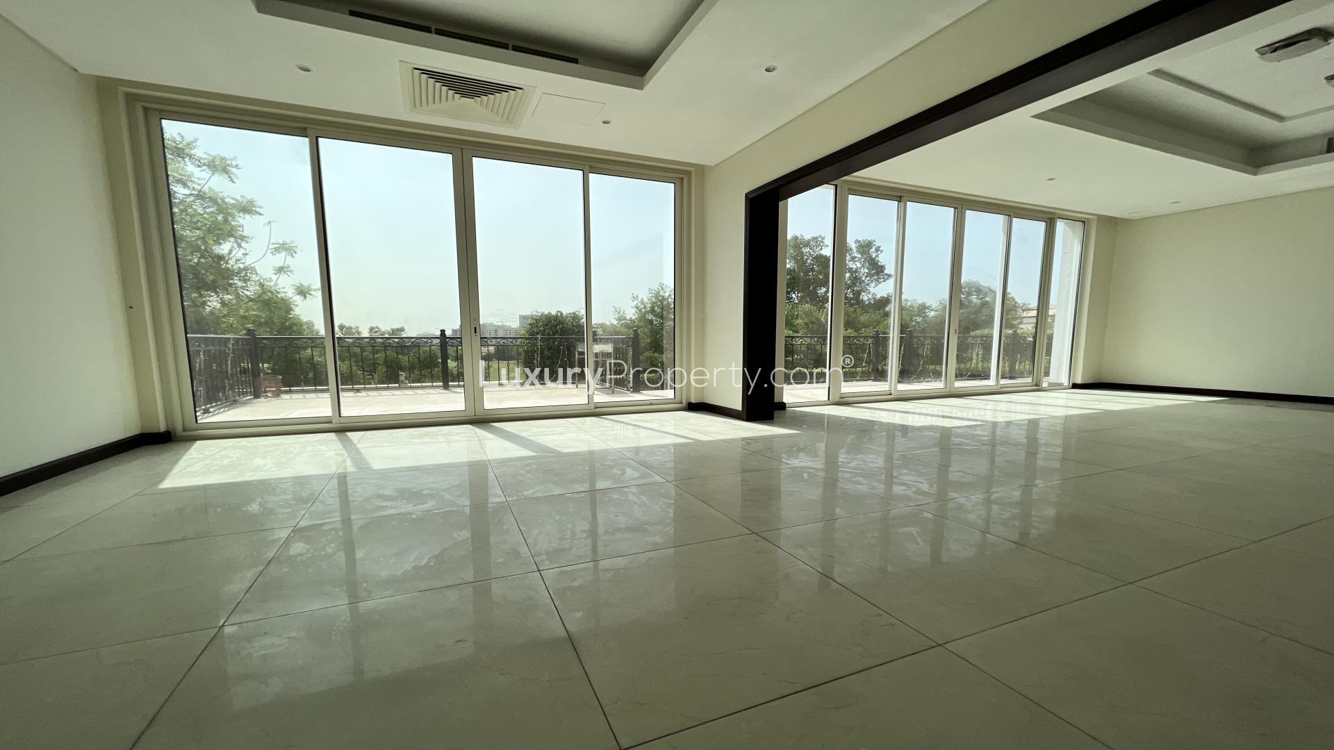 Aerial view of villa pool and golf course in Whispering Pines, Jumeirah Golf Estates