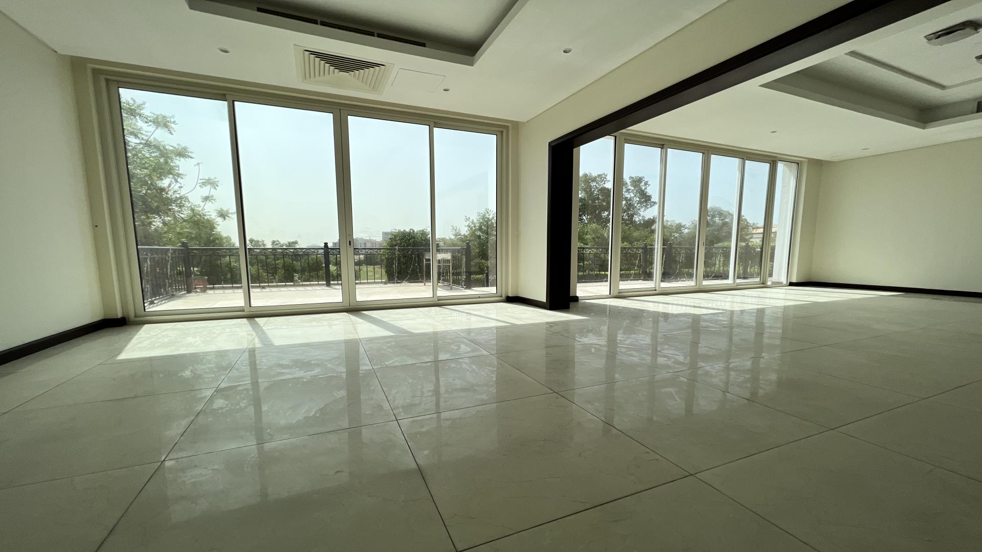 Aerial view of villa pool and golf course in Whispering Pines, Jumeirah Golf Estates