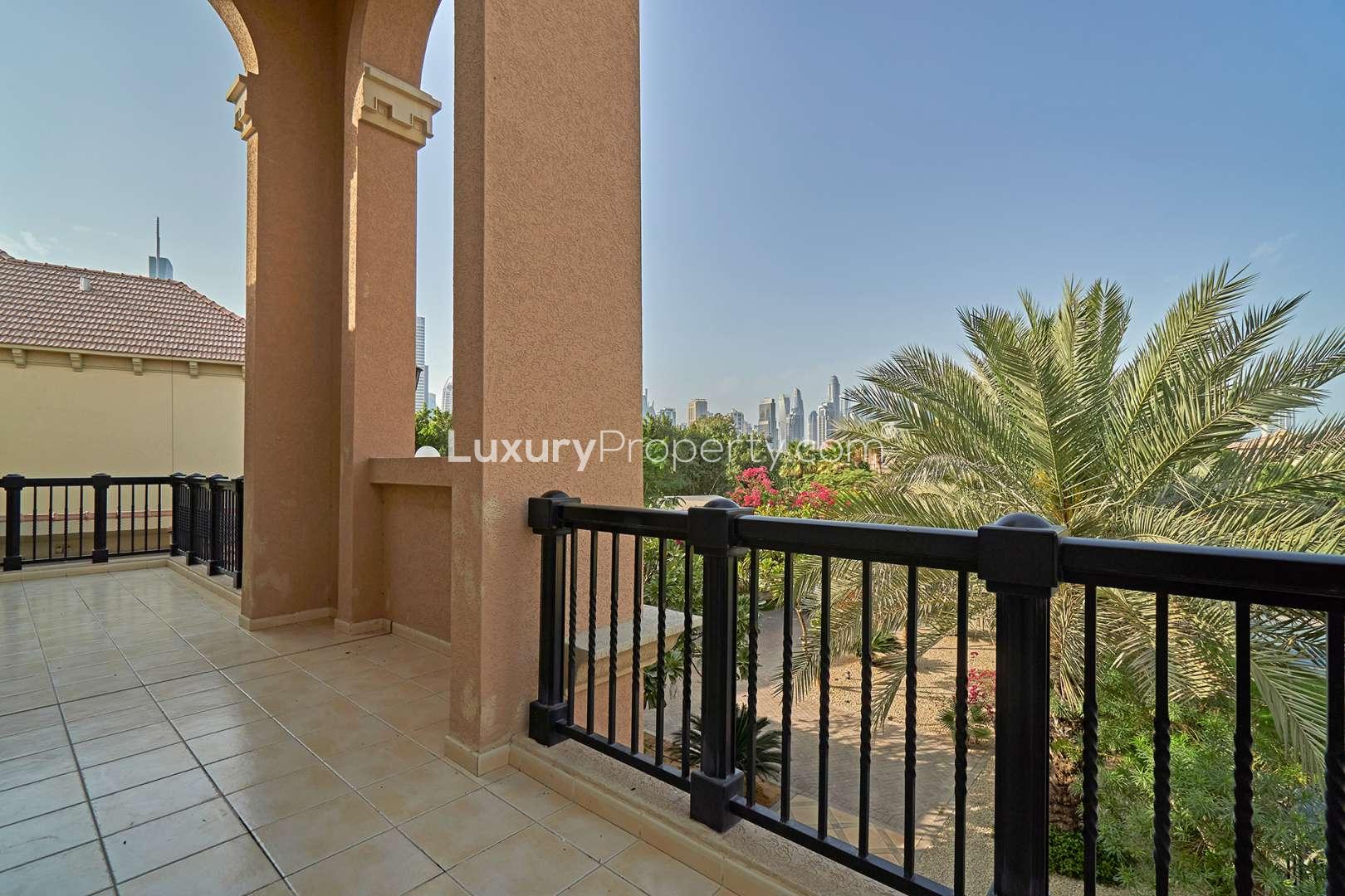 Spacious bedroom with built-in wardrobe and en-suite bathroom in Jumeirah Islands villa