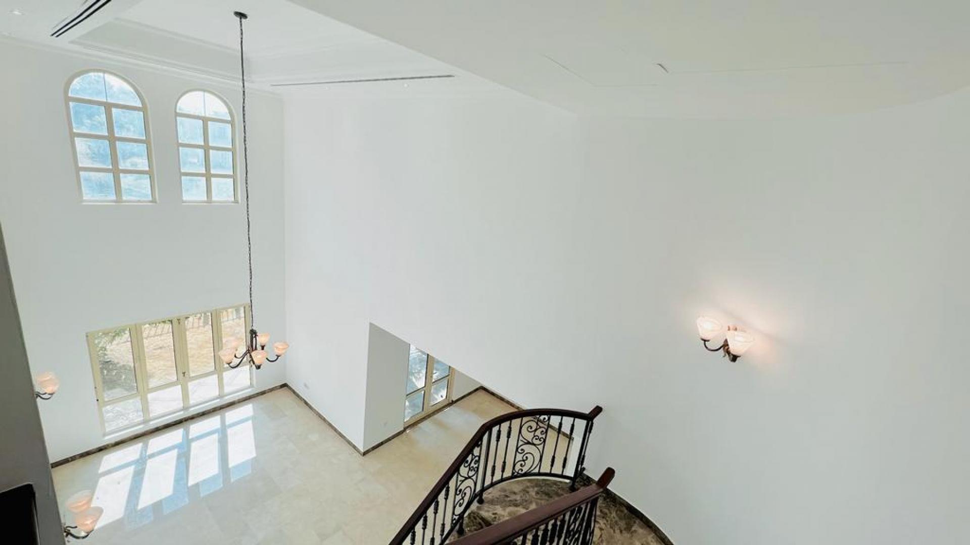 Elegant villa interior with high ceilings and large windows in Jumeirah Islands, Dubai