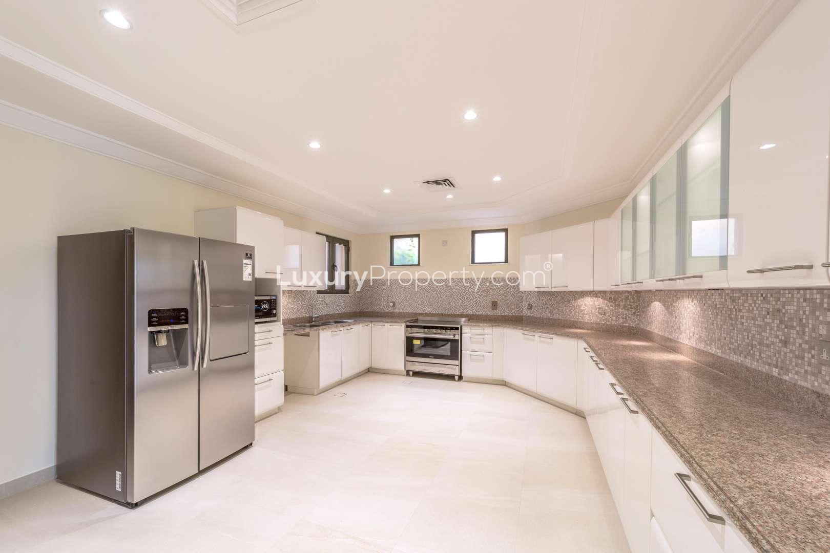 Spacious living room in 4-bedroom villa, Palm Jumeirah, featuring elegant furnishings and modern design