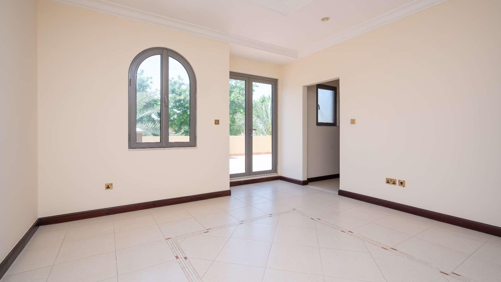 Empty room with large windows in Palm Jumeirah villa, Garden Homes, available for rent