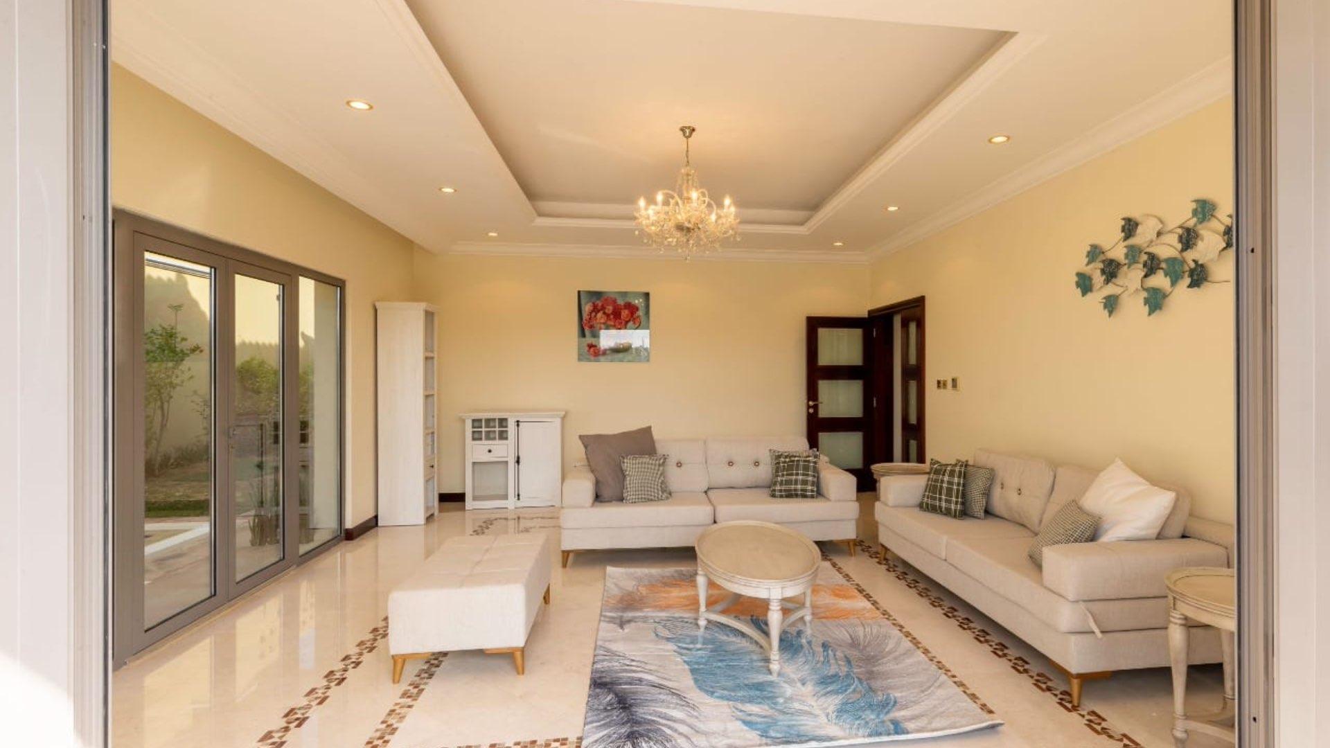 Luxurious Palm Jumeirah villa with private pool and elegant exterior, available for rent