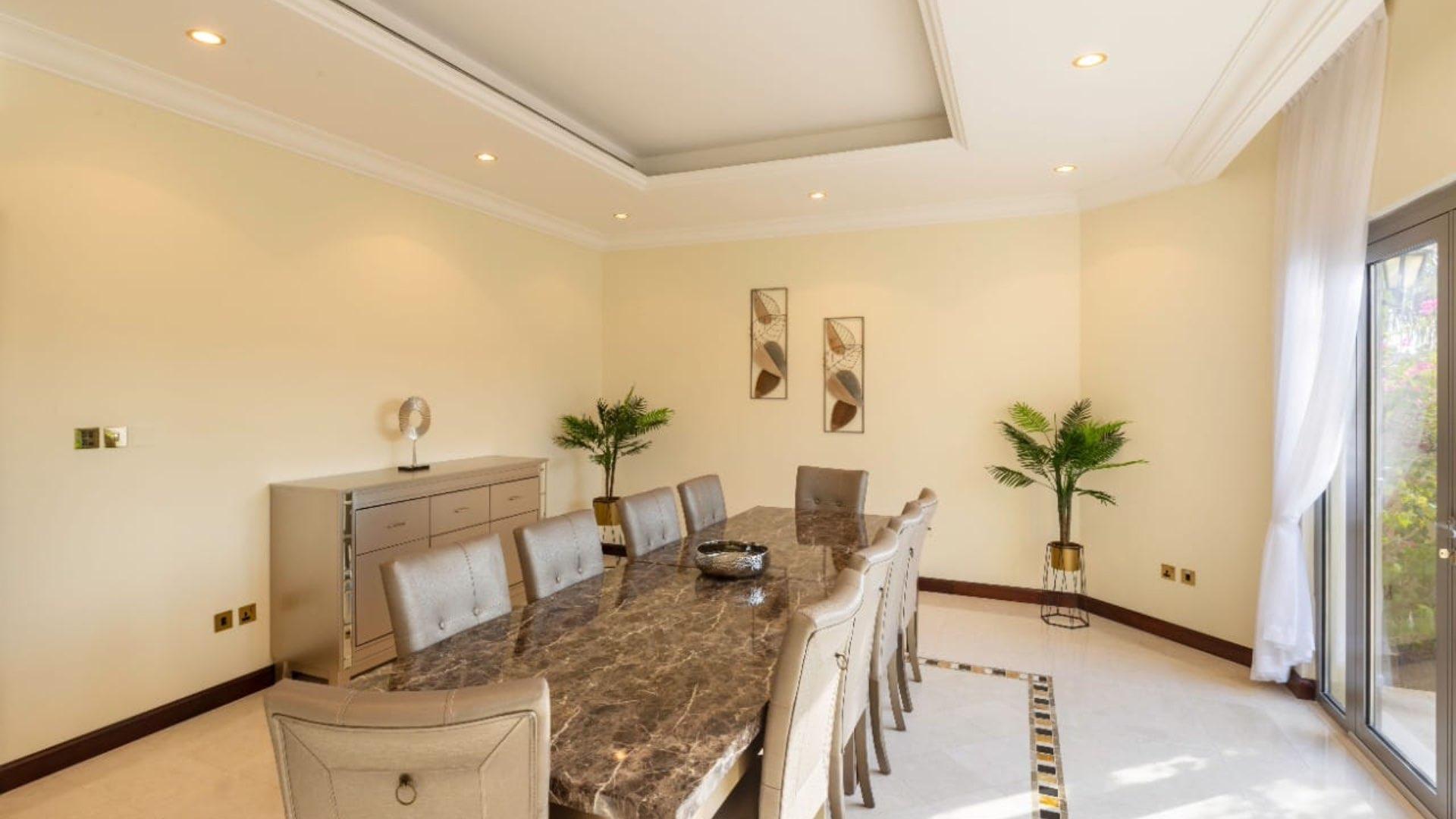 Luxurious living room in Palm Jumeirah villa with pool view, Garden Homes