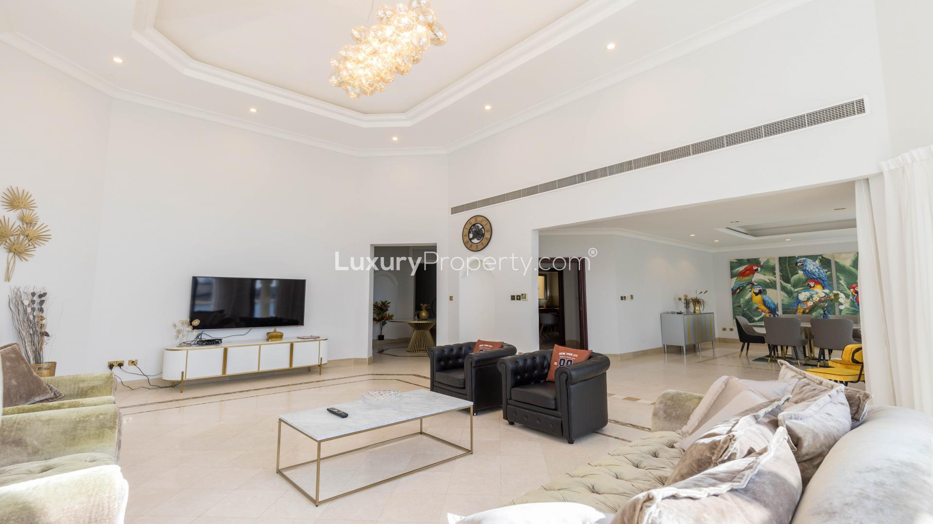 Beachfront villa in Palm Jumeirah's Garden Homes, showcasing luxury living and stunning architecture