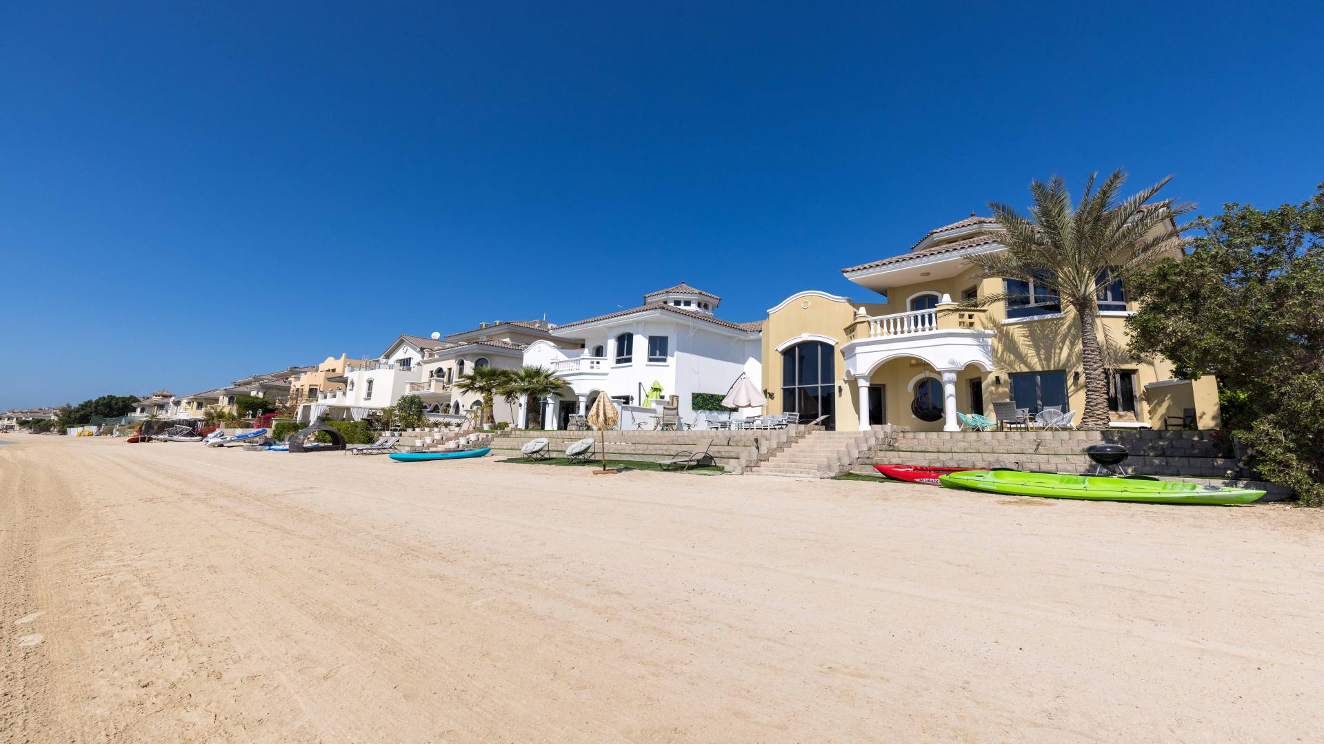 Beachfront view from Garden Homes villa in Palm Jumeirah, Dubai, with clear blue waters