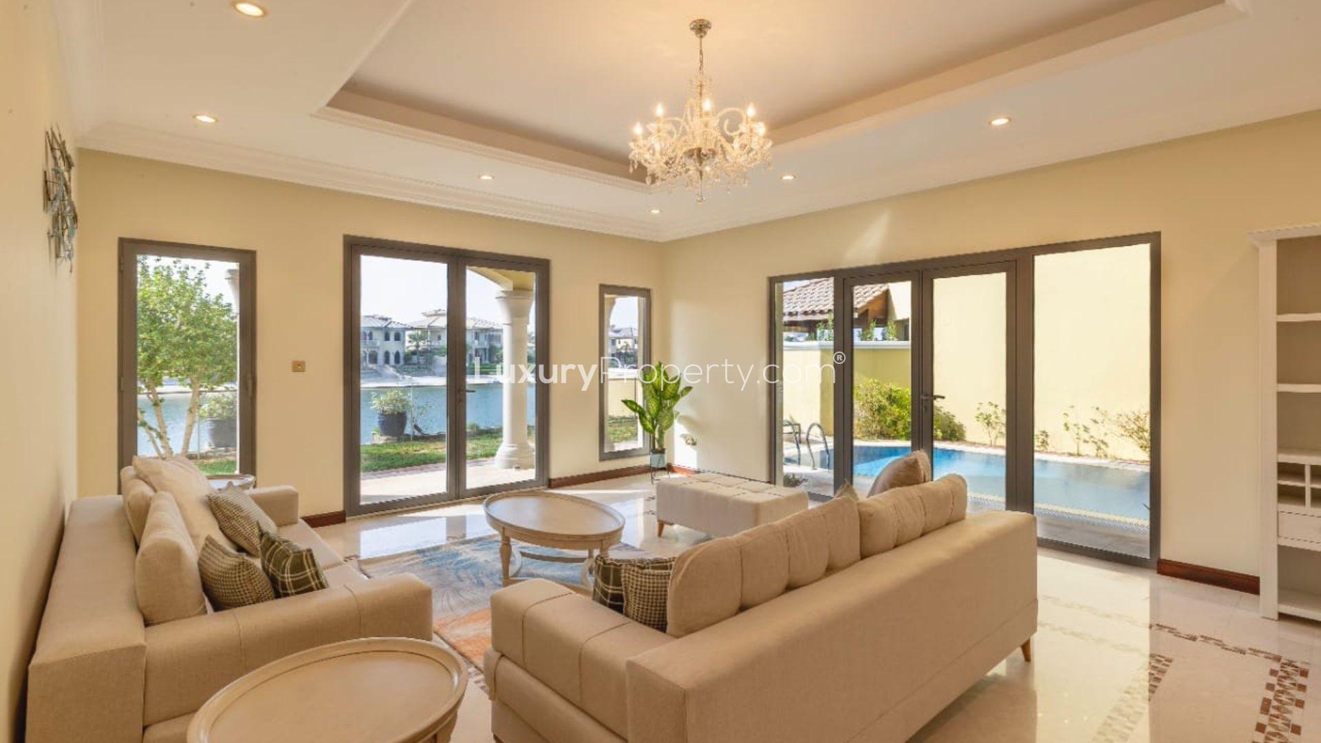 Palm Jumeirah villa with private pool, spacious patio, and elegant architecture for rent