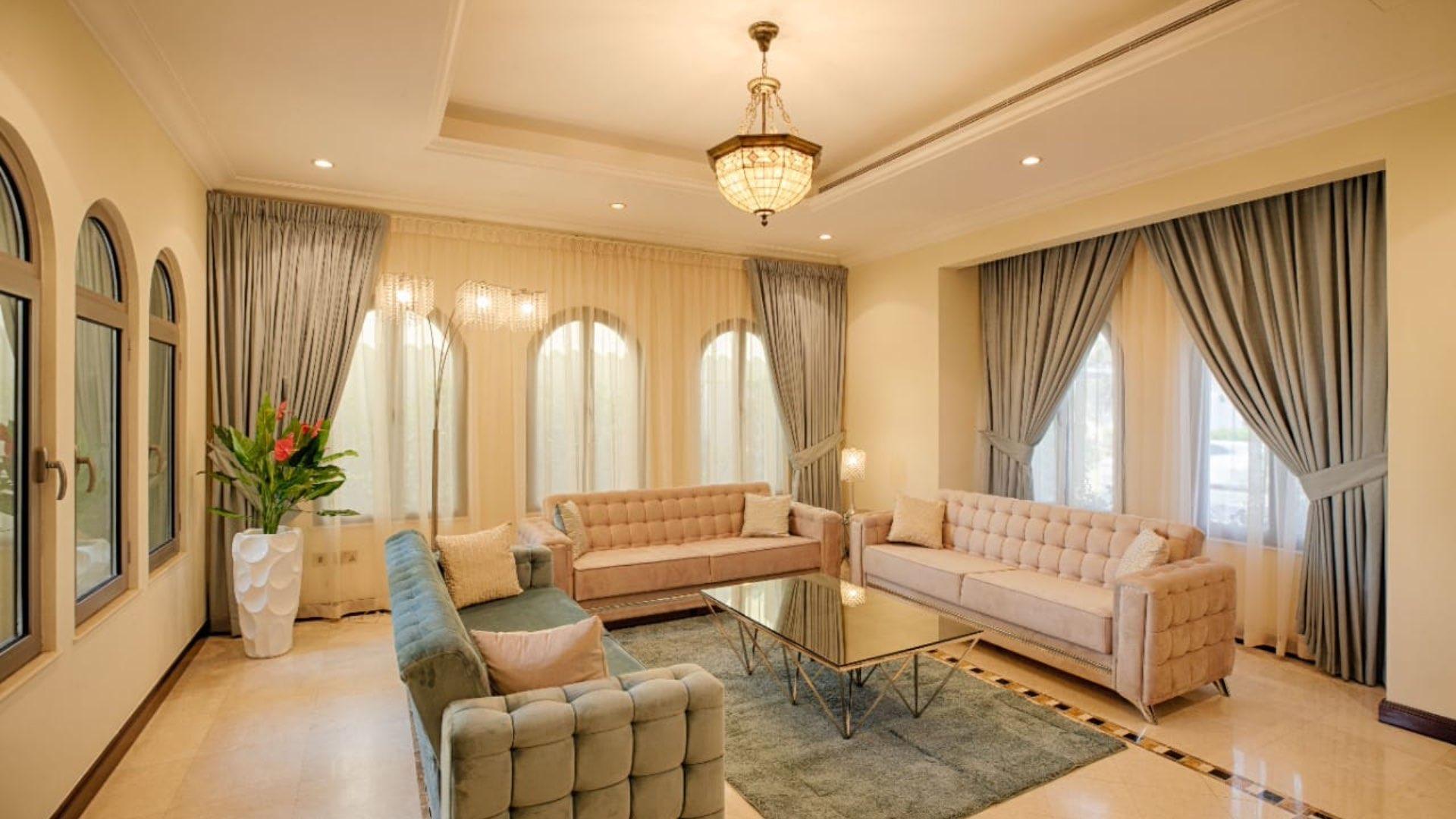 Luxurious living room with pool view in Palm Jumeirah villa for rent
