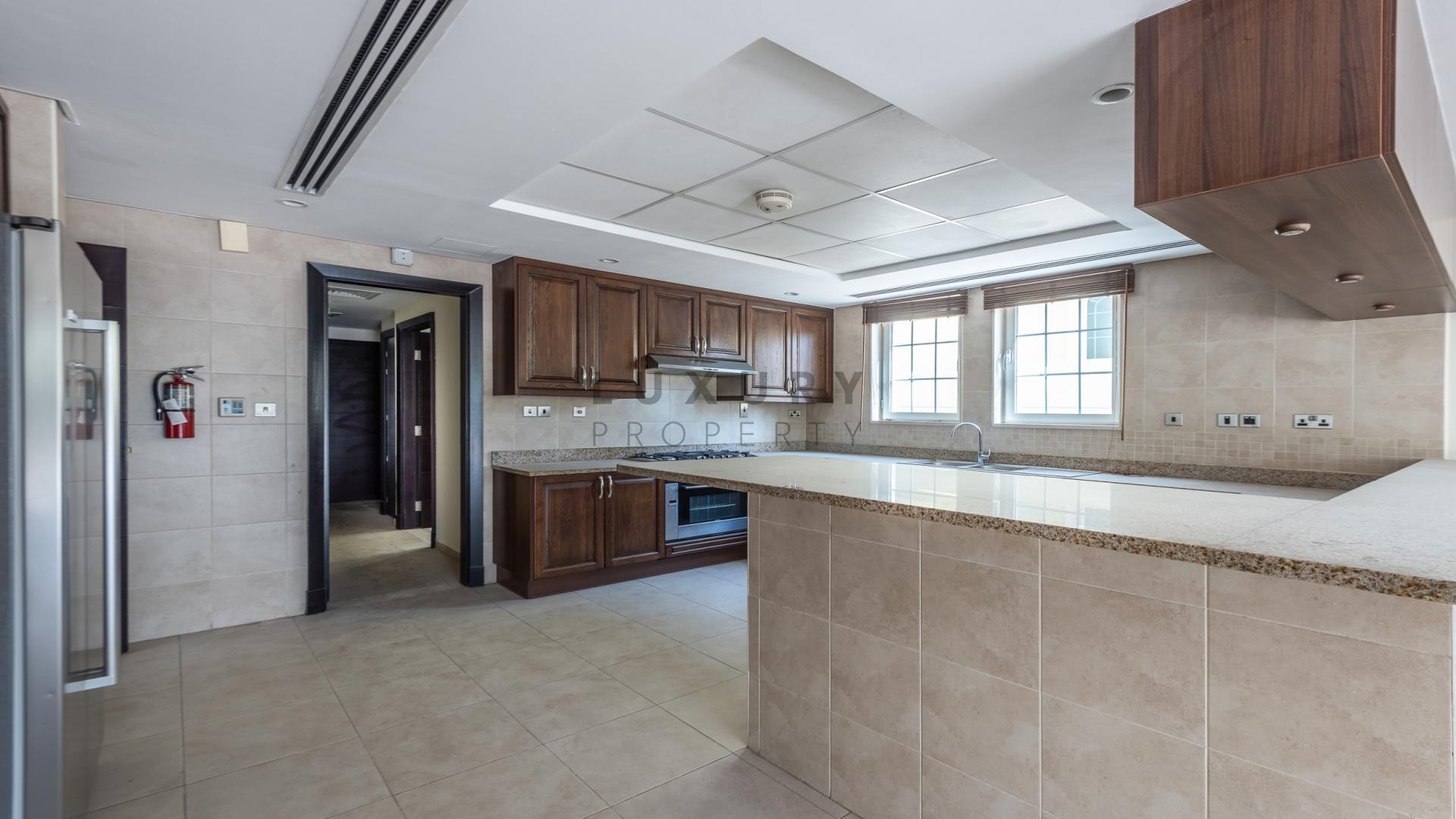 Spacious living area in Legacy Villa, Jumeirah Park, featuring modern staircase and open layout