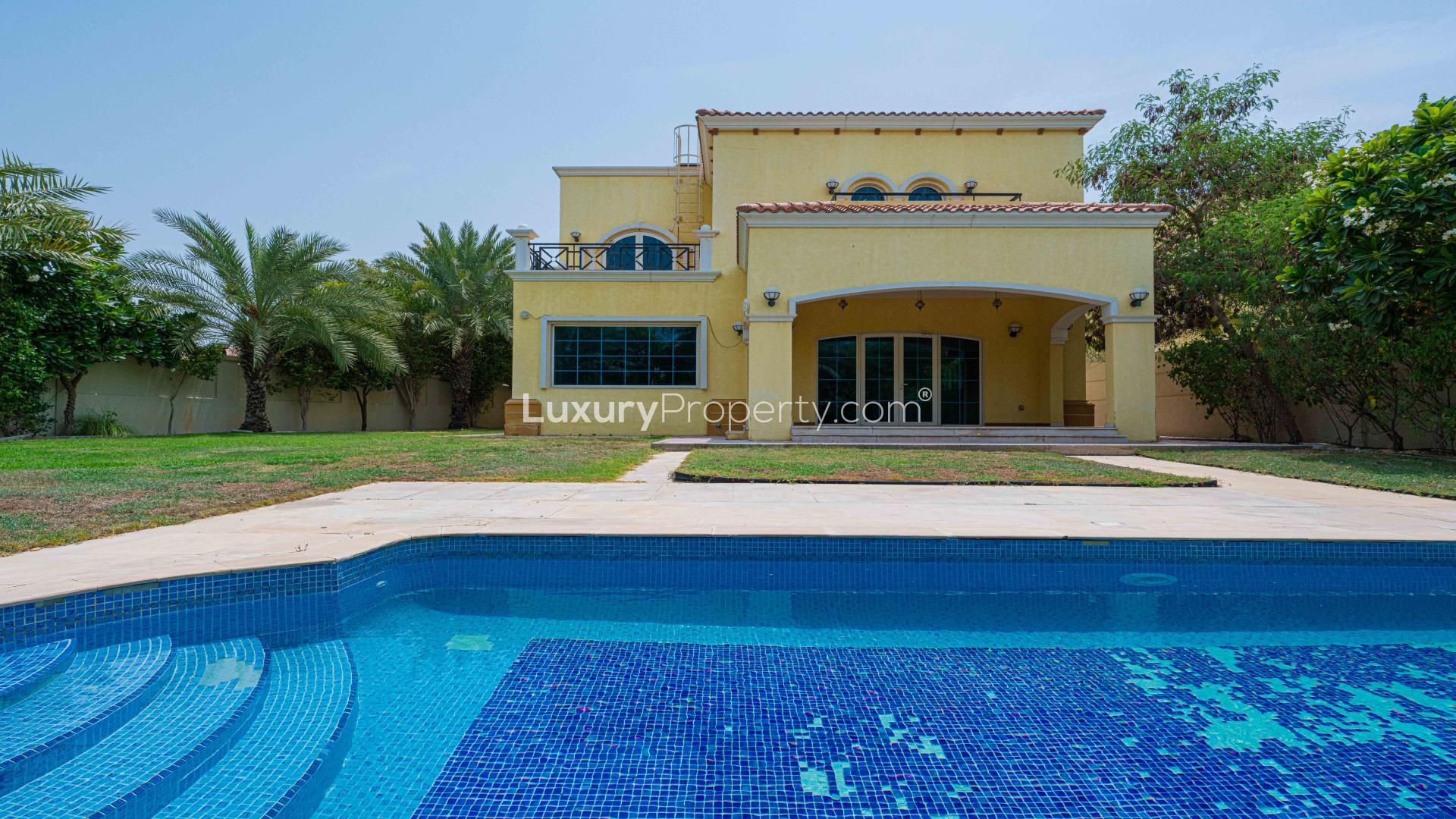 Spacious kitchen with wooden cabinets in 4-bedroom Jumeirah Park villa for rent