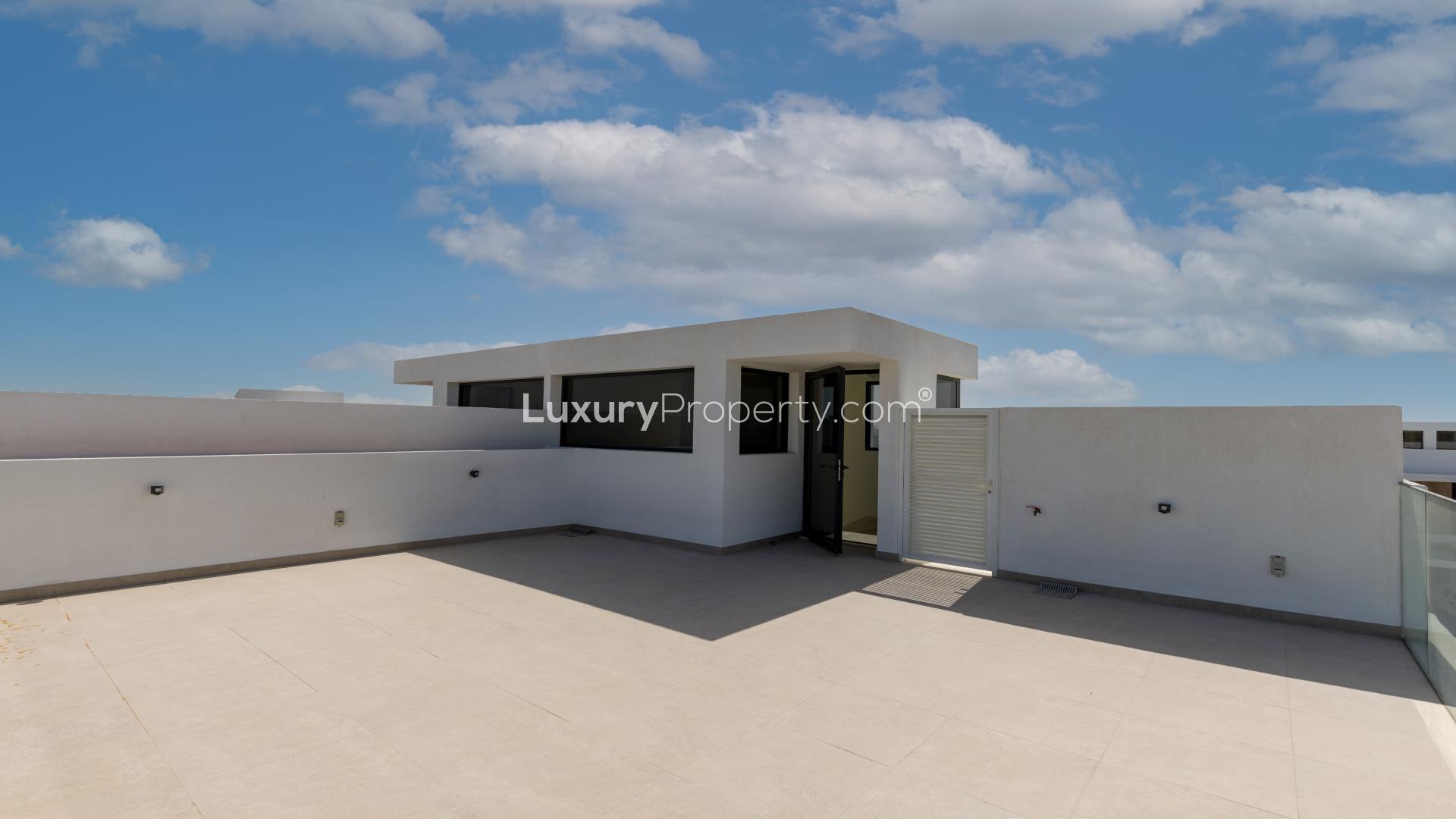 Spacious living room with large windows in Dubai Hills Estate Golf Grove villa