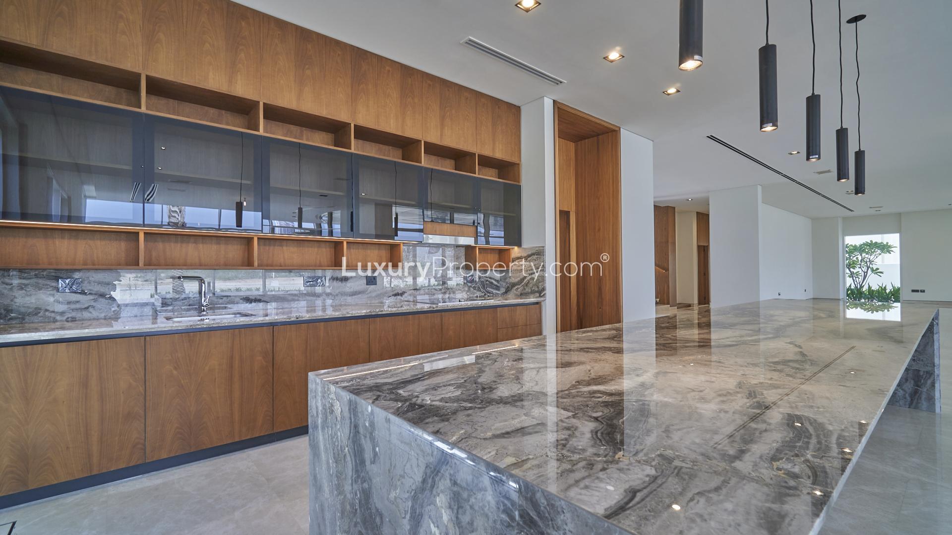 Brand new villa terrace with glass railing overlooking Dubai Hills Golf Course