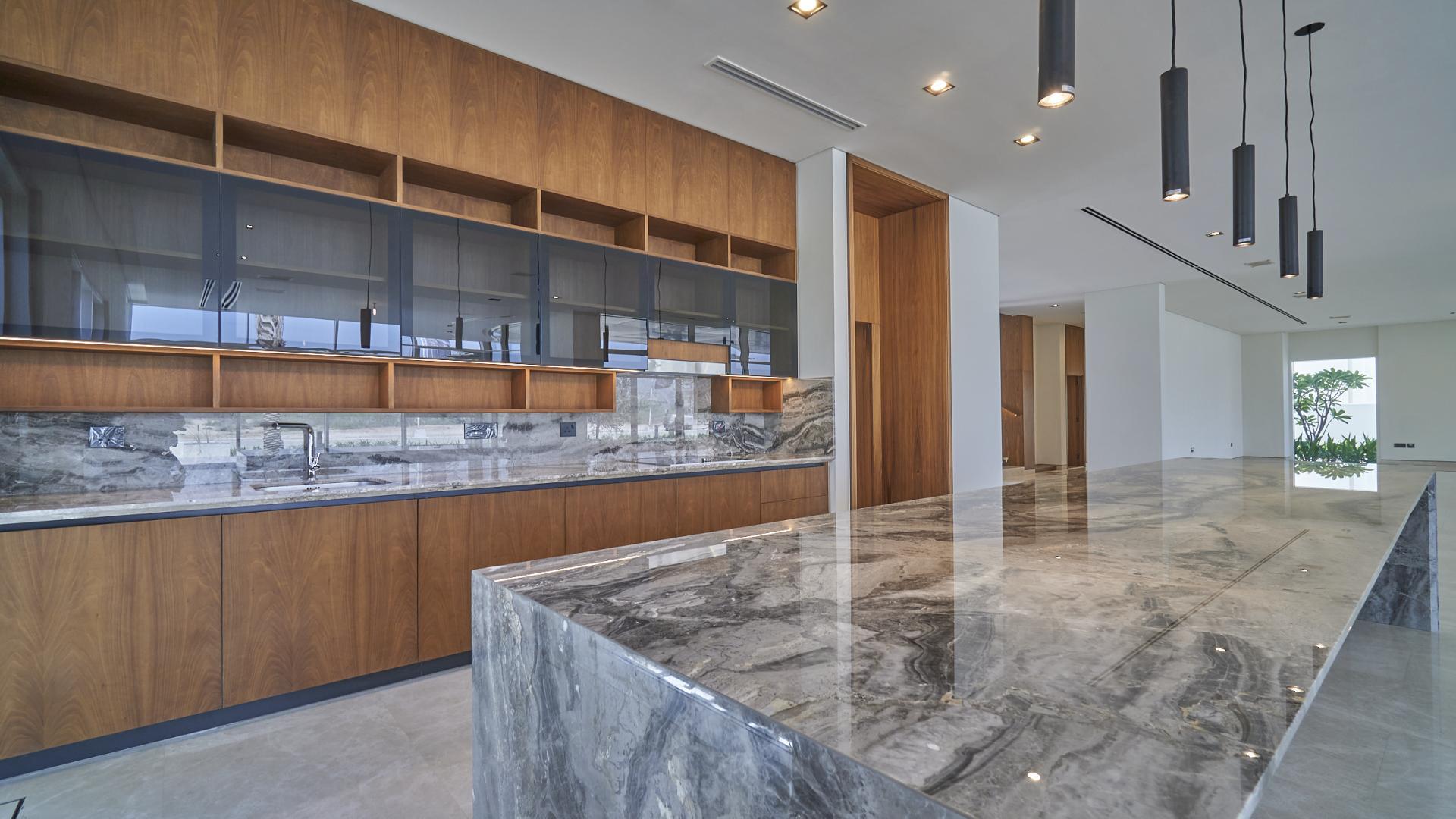 Brand new villa terrace with glass railing overlooking Dubai Hills Golf Course