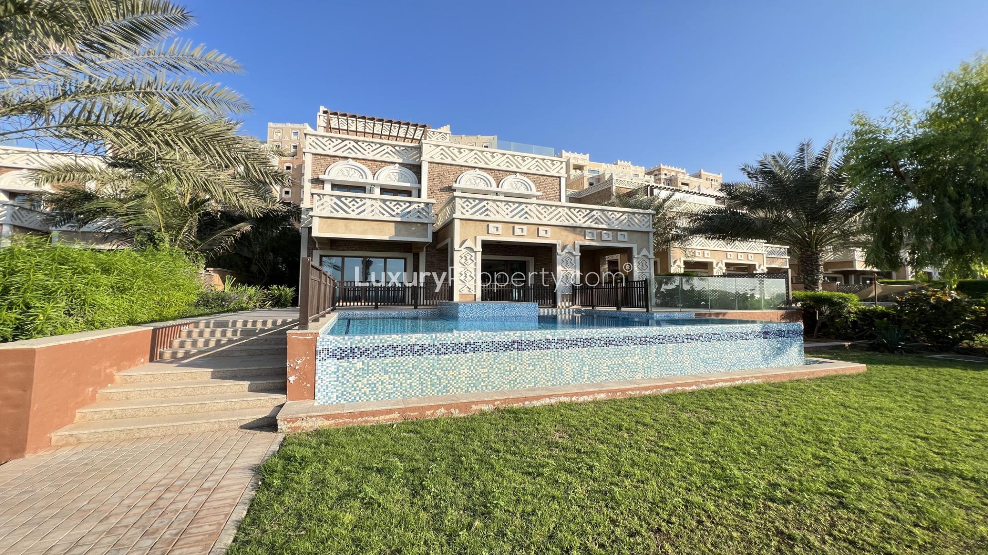 Stylish living room in upgraded Palm Jumeirah villa with modern decor and marble accents