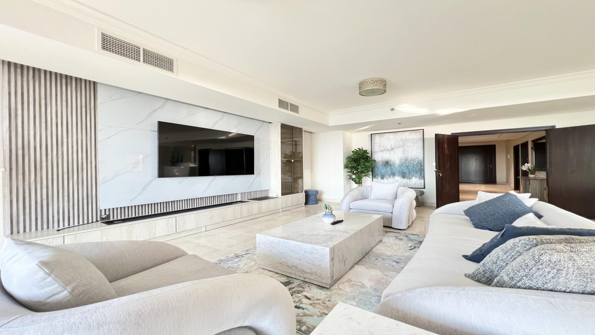 Elegant living room in Palm Jumeirah villa, featuring modern decor and spacious seating area