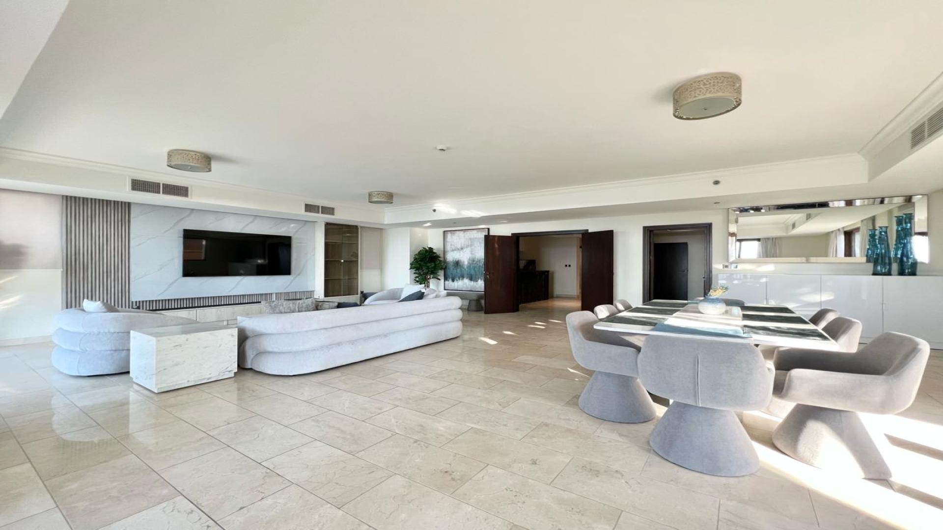 Elegant living room in Palm Jumeirah villa, featuring modern decor and plush seating