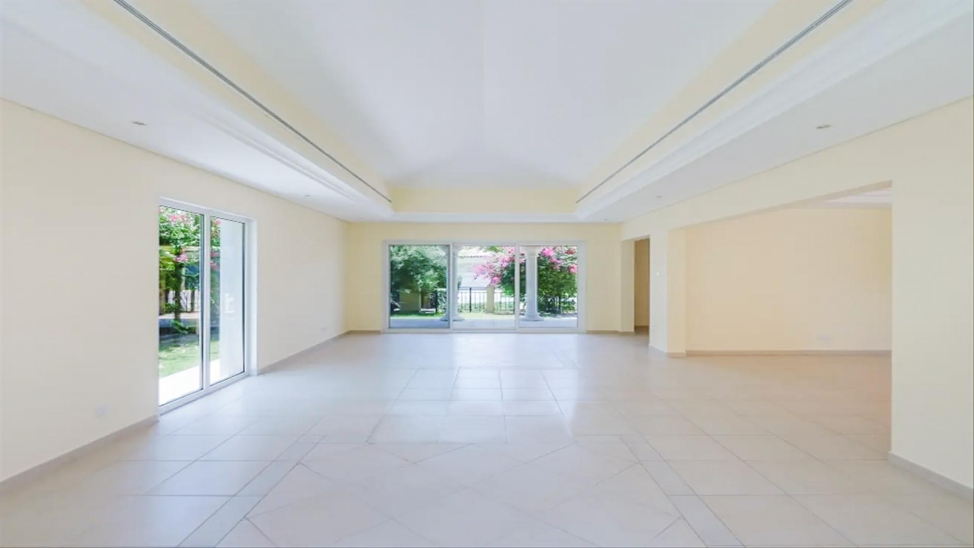 Spacious living area in 4-bedroom villa, Green Community West, Dubai, with large windows