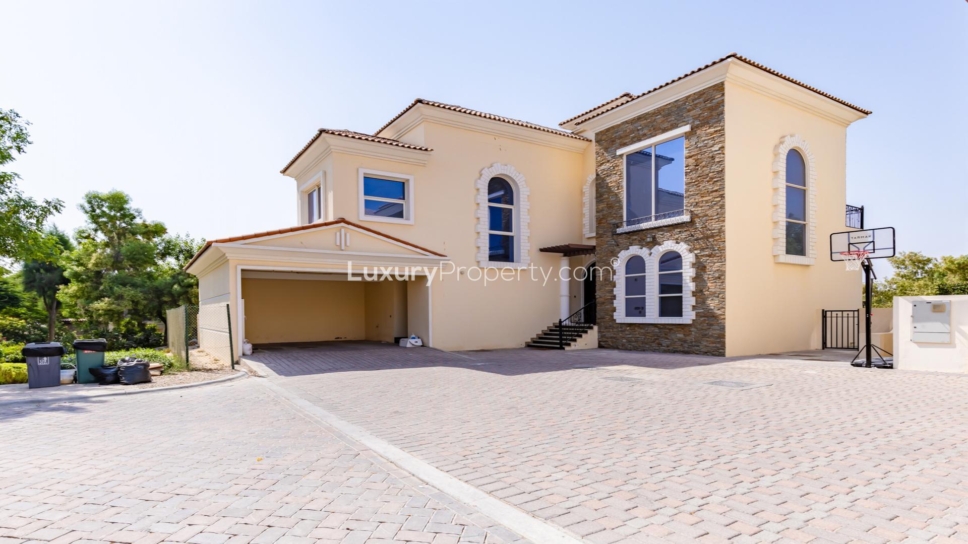 Luxurious villa interior with large windows overlooking golf course in Jumeirah Golf Estates