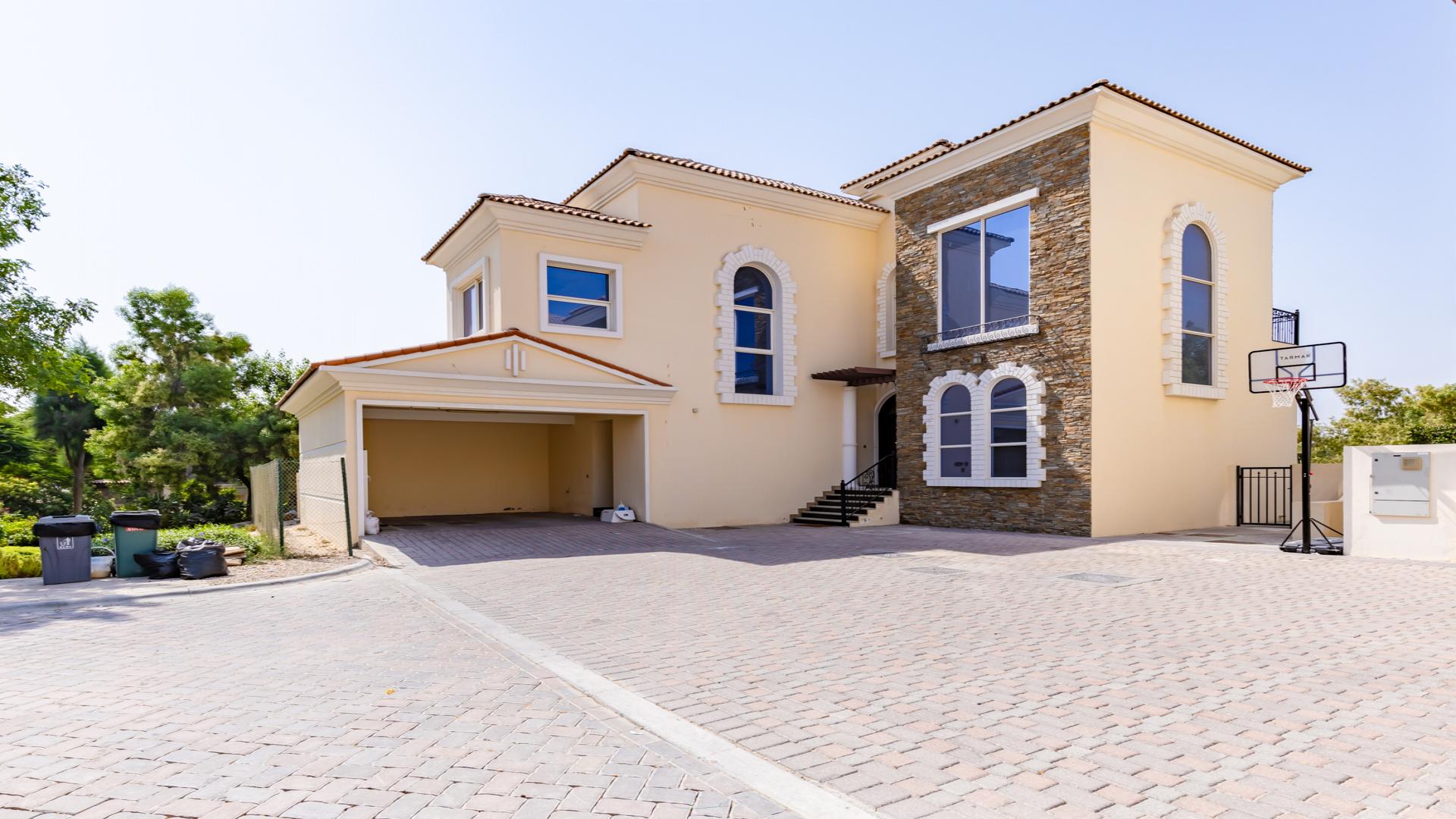 Luxurious villa interior with large windows overlooking golf course in Jumeirah Golf Estates