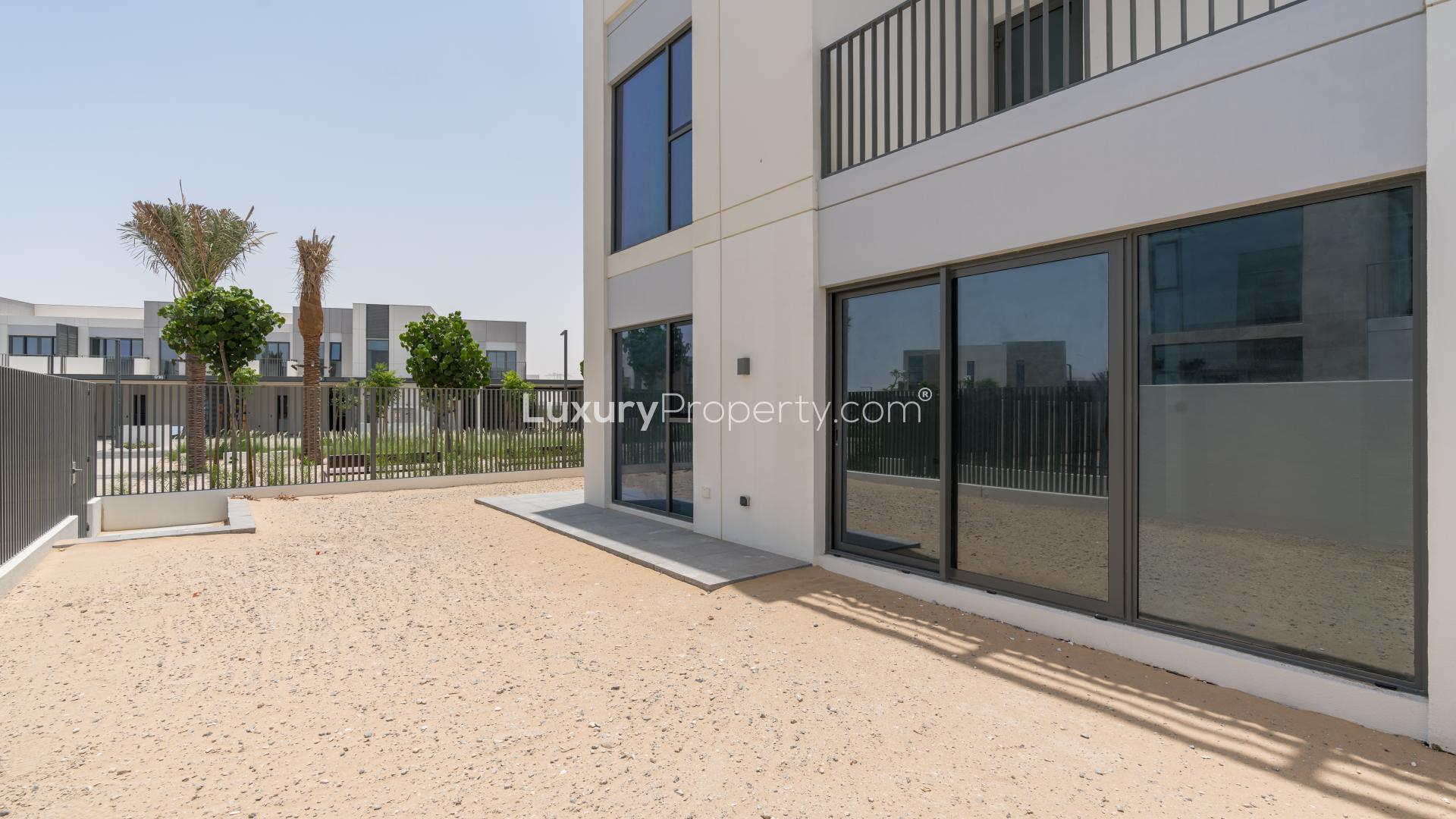 Luxurious 4-bedroom villa interior kitchen and living area, Joy, Arabian Ranches III, Dubai