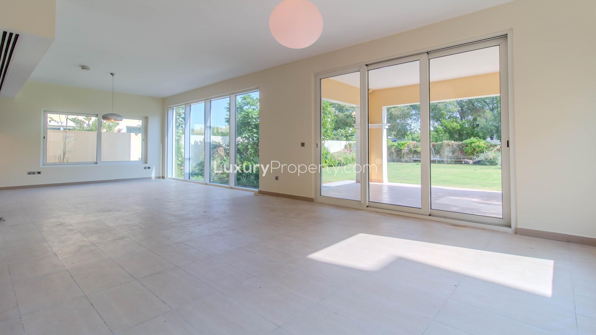 "Spacious villa interior with garden view in Legacy Nova Villas, Jumeirah Park for rent.",Spacious villa interior with large windows overlooking landscaped garden in Jumeirah Park