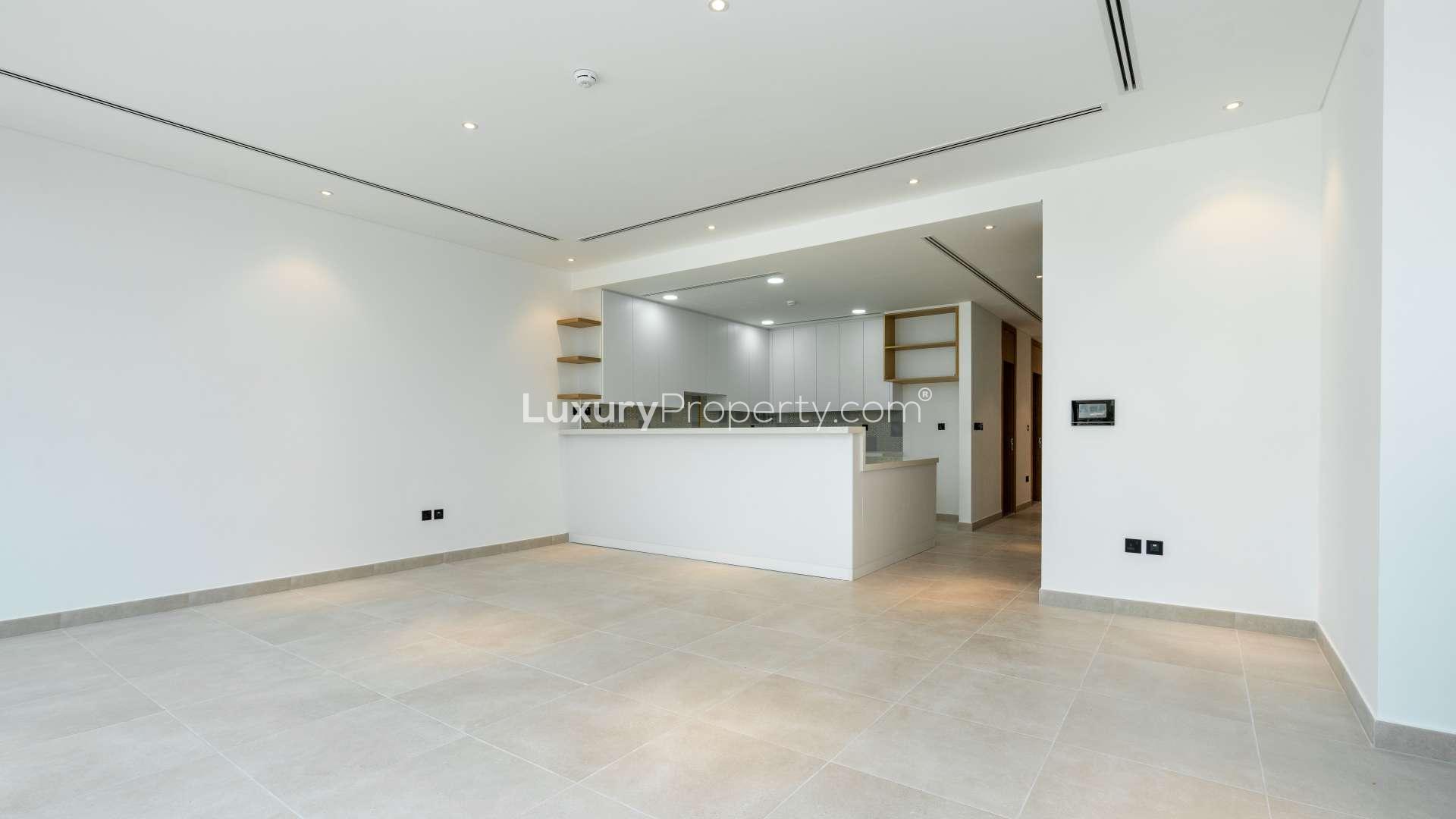 Luxurious Jumeirah Golf Estates villa view with lush greenery and golf course