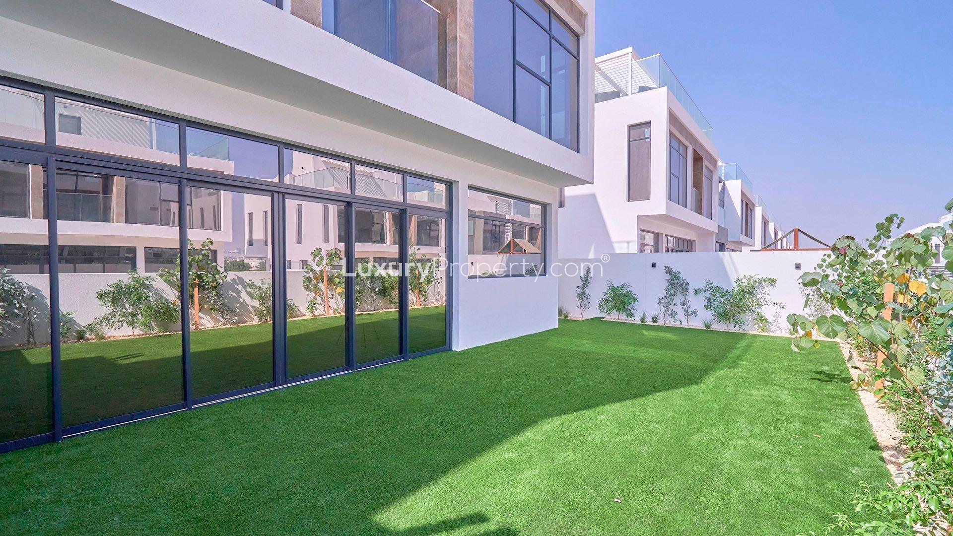 Contemporary 4-bedroom villa exterior with modern design in Jumeirah Golf Estates for rent