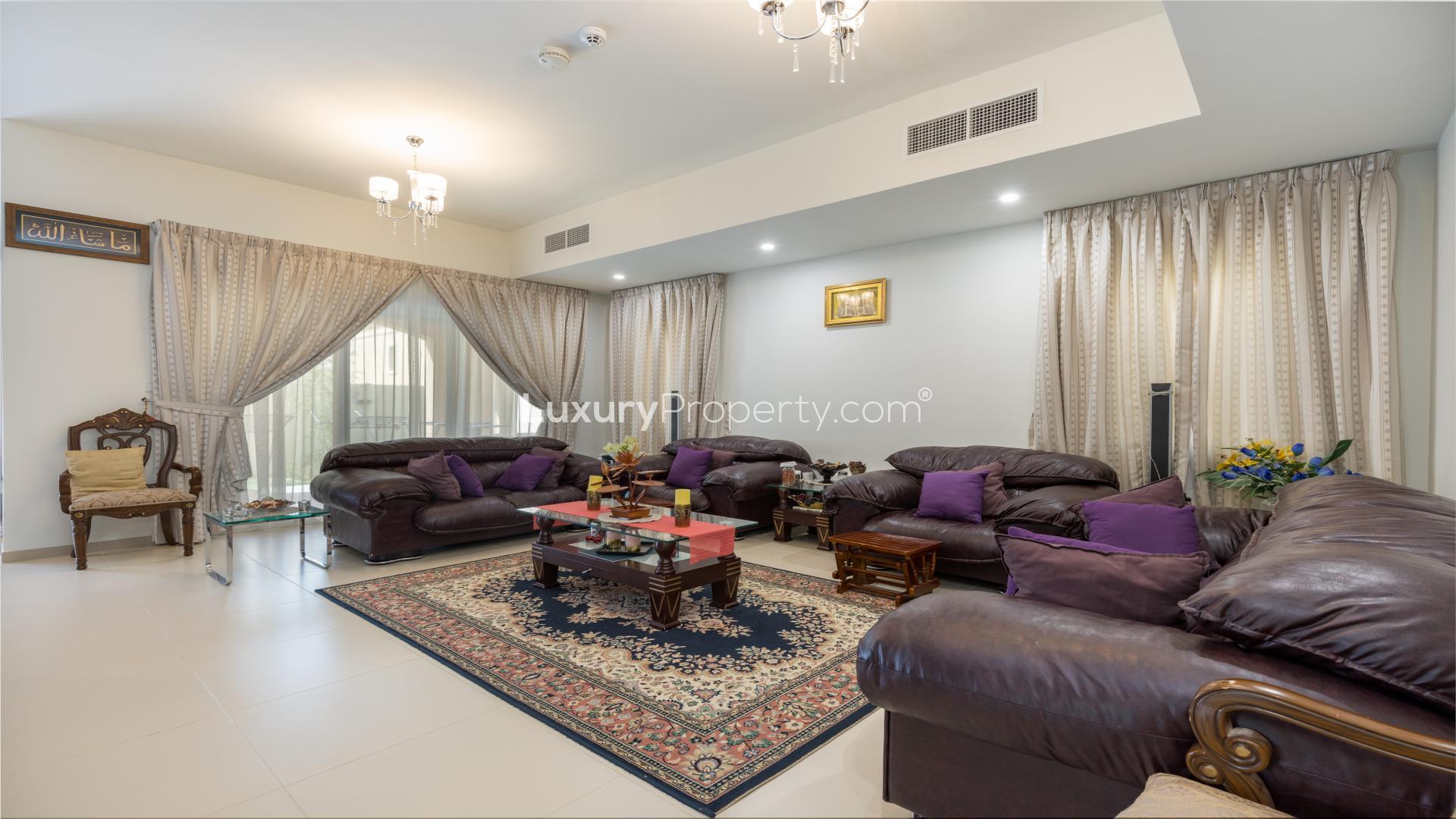 Balcony view of Villanova villa in Dubai Land with landscaped garden