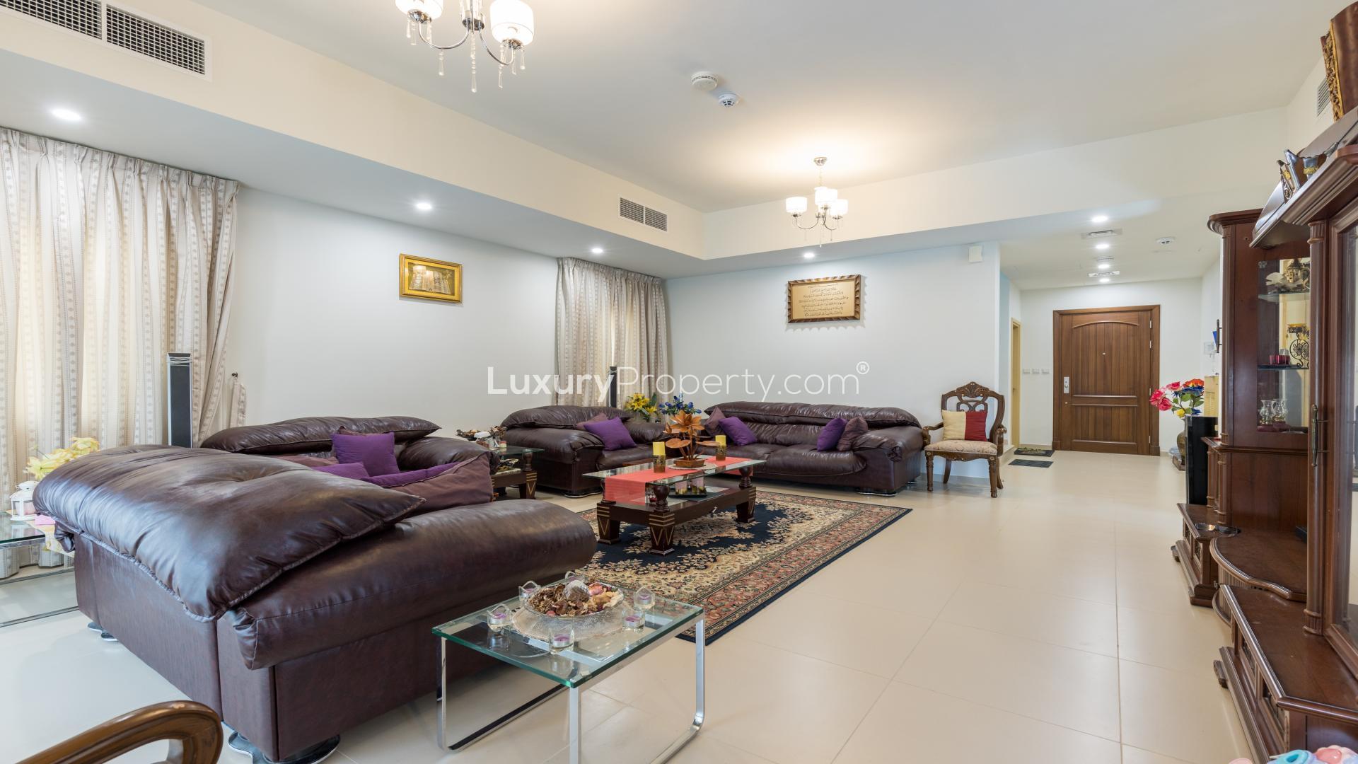 Luxurious living room in Villanova villa, Dubai Land, with elegant decor and plush seating