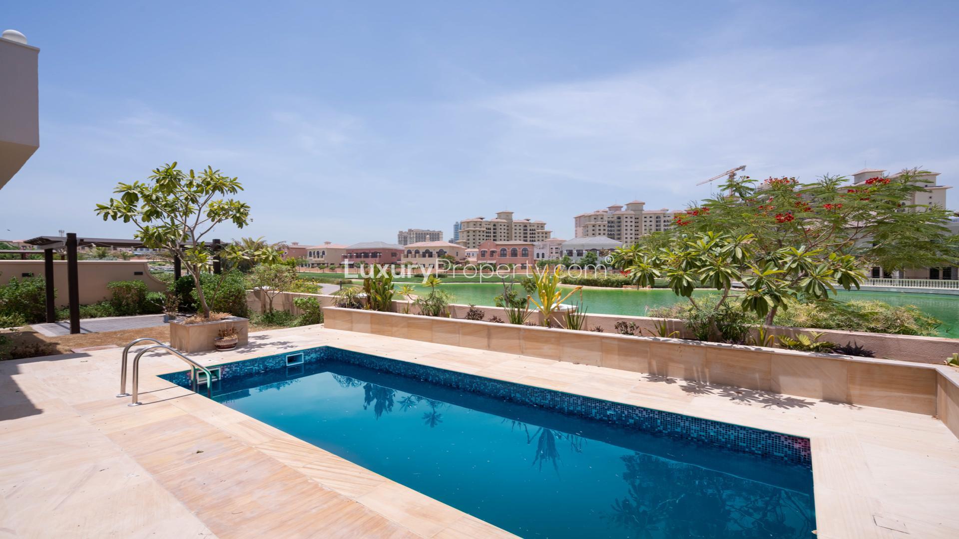 Spacious living area in 4-bedroom villa, Orange Lake, Jumeirah Golf Estates, with garden views