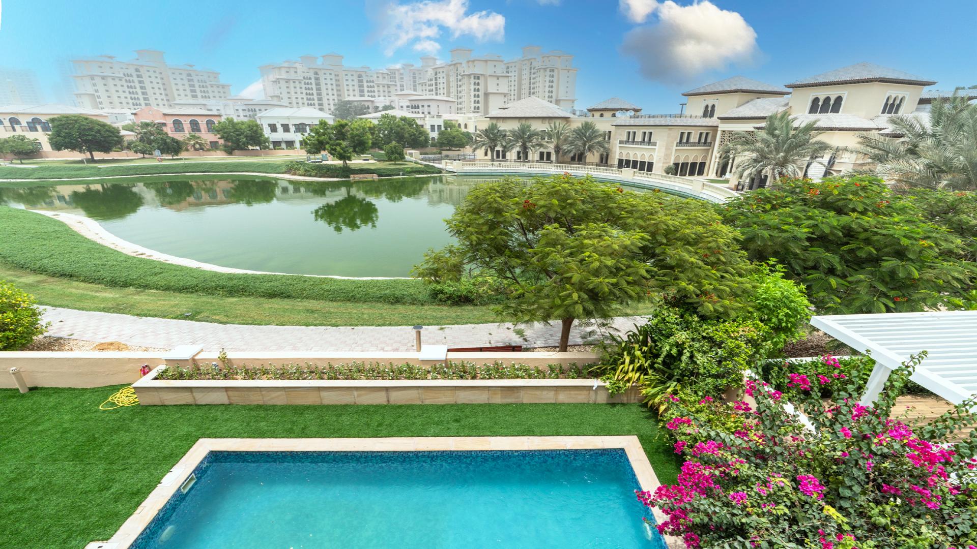 Spacious villa living room with marble floors, large windows in Jumeirah Golf Estates, Fire