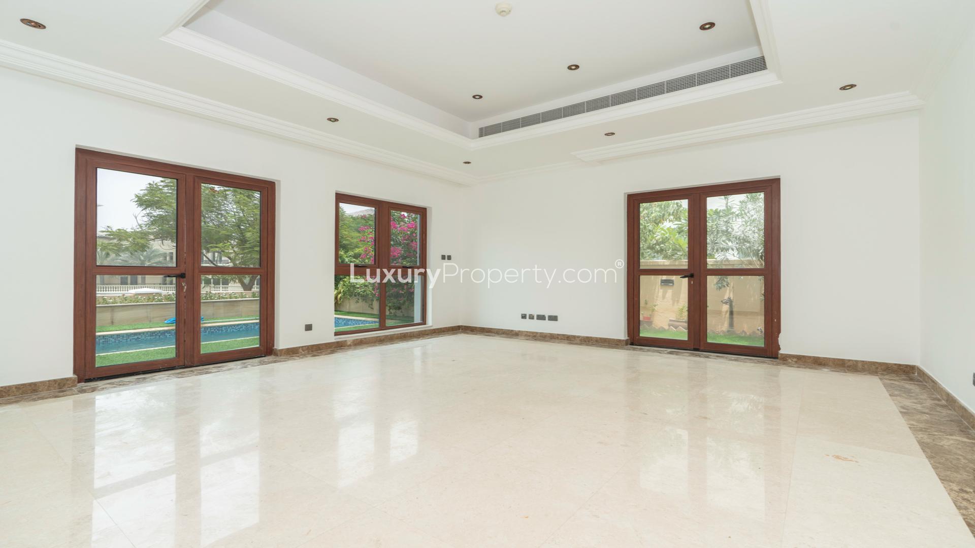 Villa with private pool and lake views in Jumeirah Golf Estates, Fire community