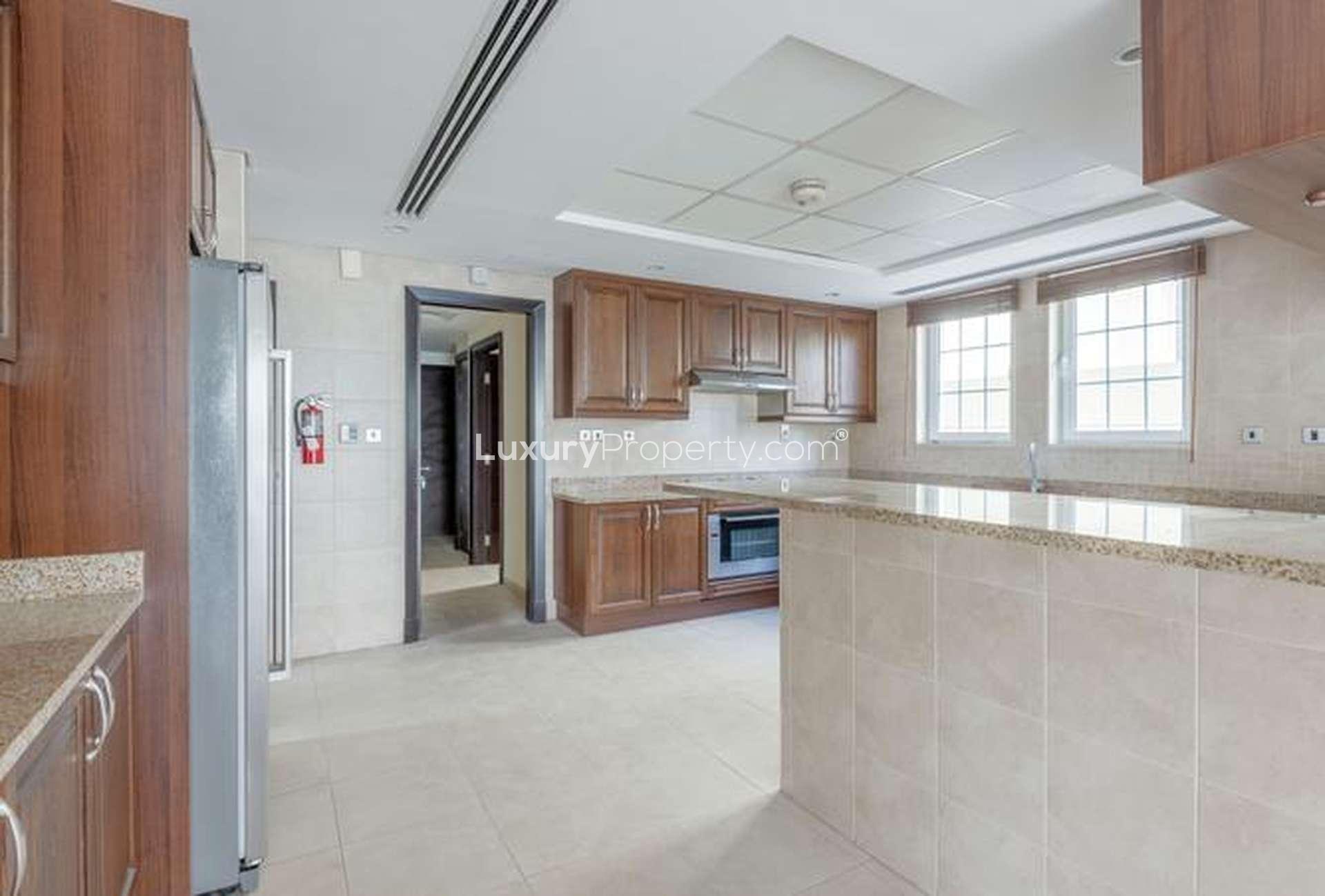 Spacious living area in 4-bedroom Legacy Villa, Jumeirah Park, with open-plan design and staircase