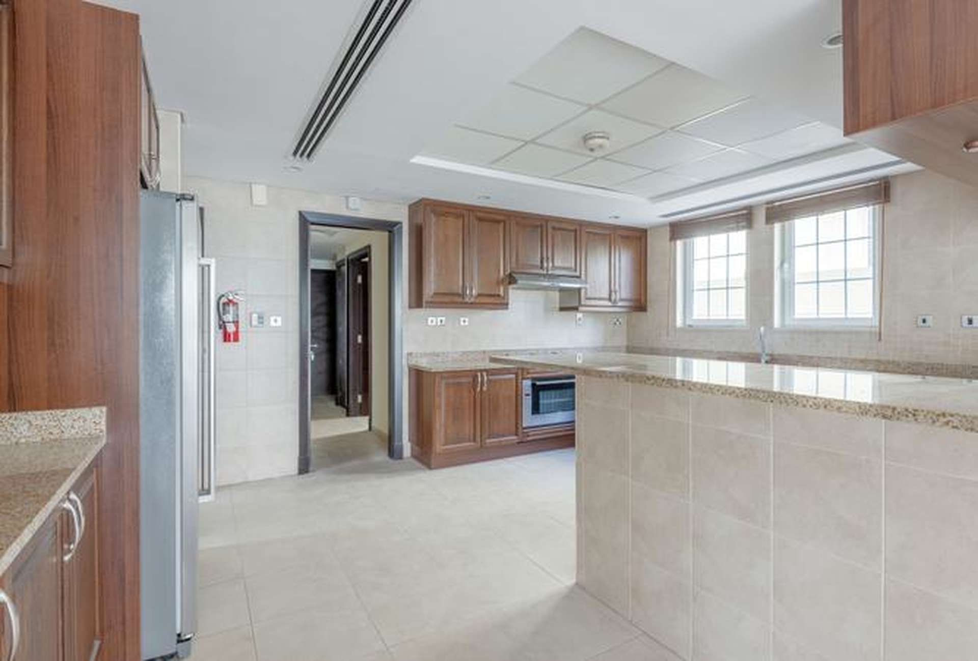 Spacious living area in 4-bedroom Legacy Villa, Jumeirah Park, with open-plan design and staircase