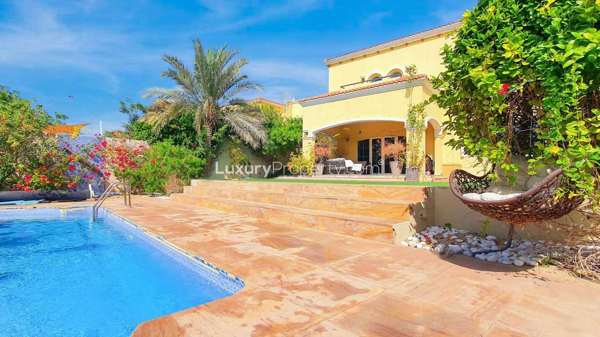 "Jumeirah Park Legacy villa patio with cozy seating and garden view, available for rent.",Jumeirah Park Legacy villa with private pool, lush garden, and spacious patio for rent