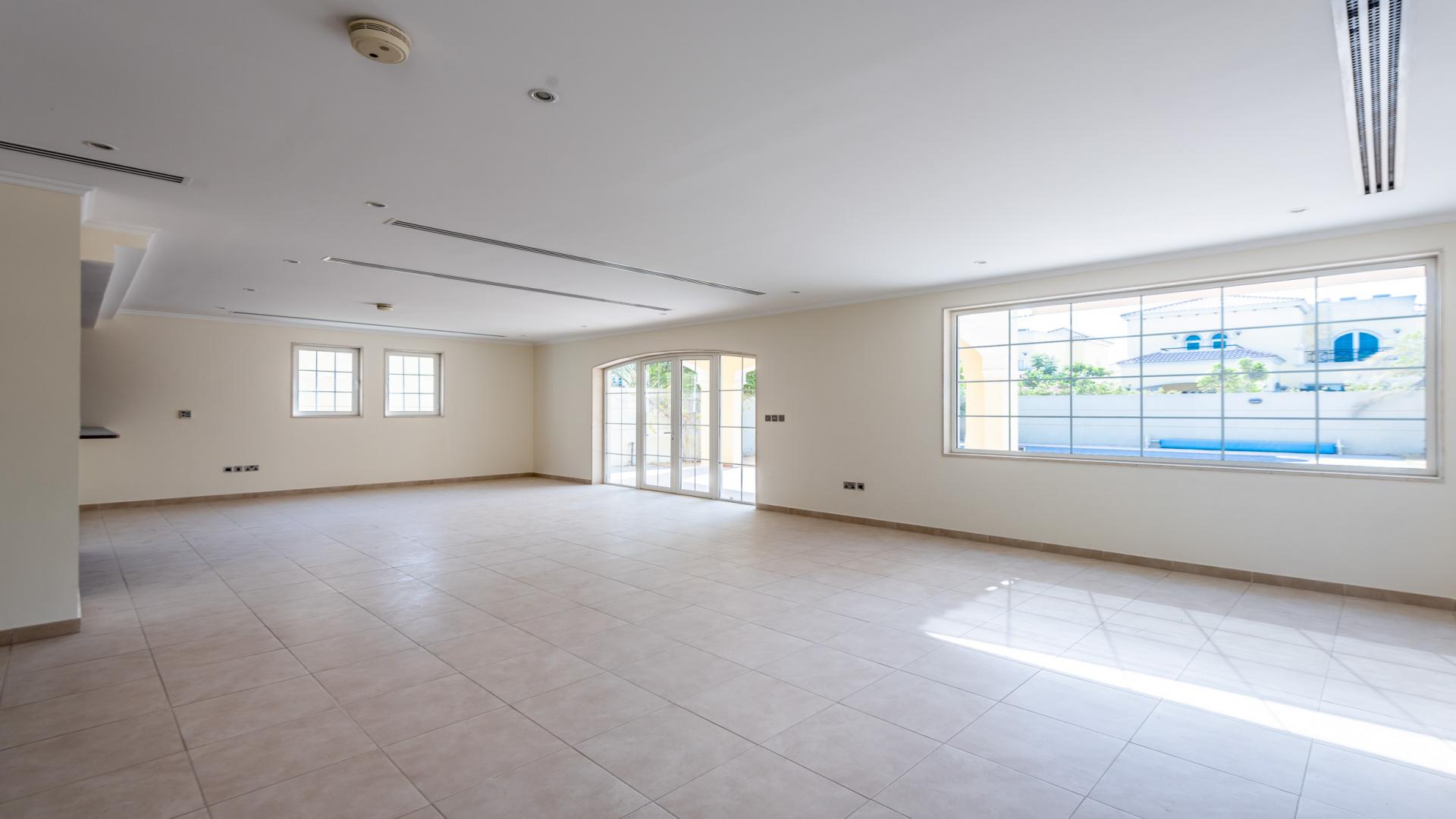 Spacious living room with staircase in 4-bedroom Legacy villa, Jumeirah Park for rent