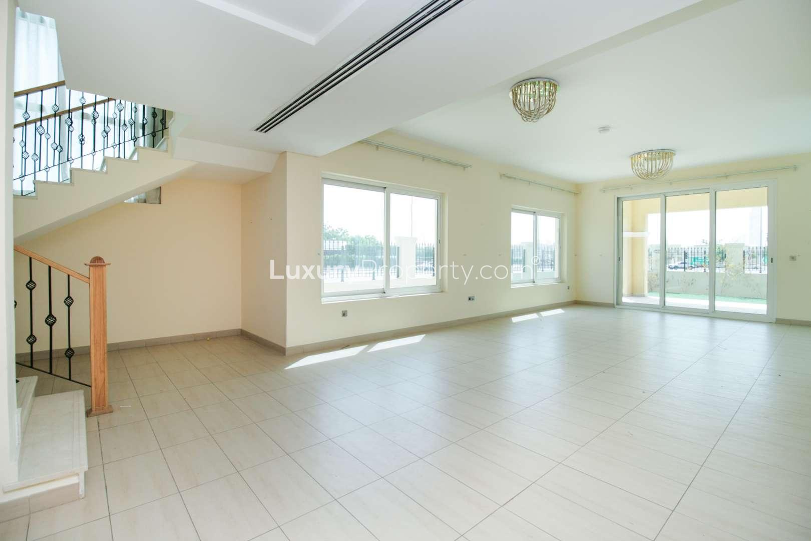 Four-bedroom villa exterior in Legacy Nova Villas, Jumeirah Park, with landscaped garden for sale