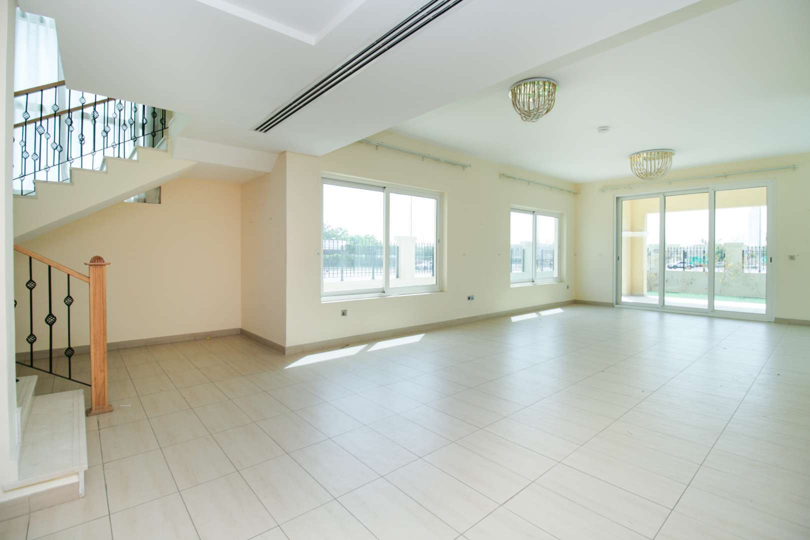Four-bedroom villa exterior in Legacy Nova Villas, Jumeirah Park, with landscaped garden for sale