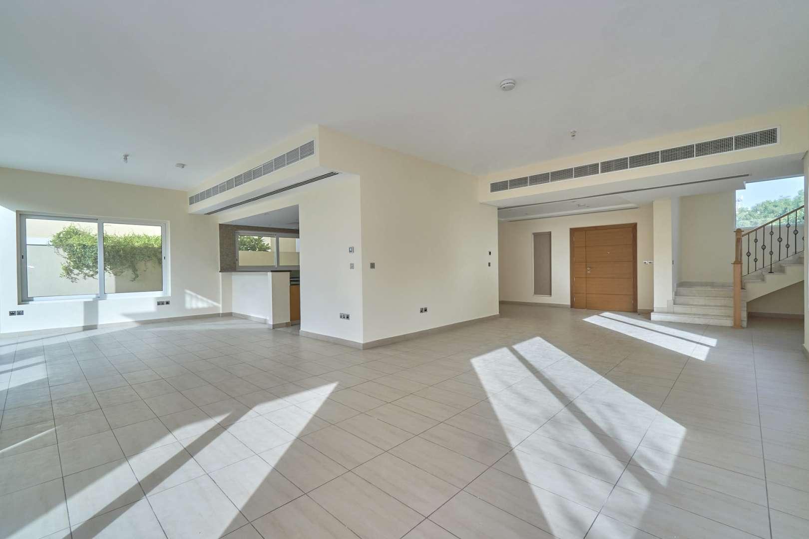 Sunlit living room with large windows in Nova Villa, Legacy Nova, Jumeirah Park