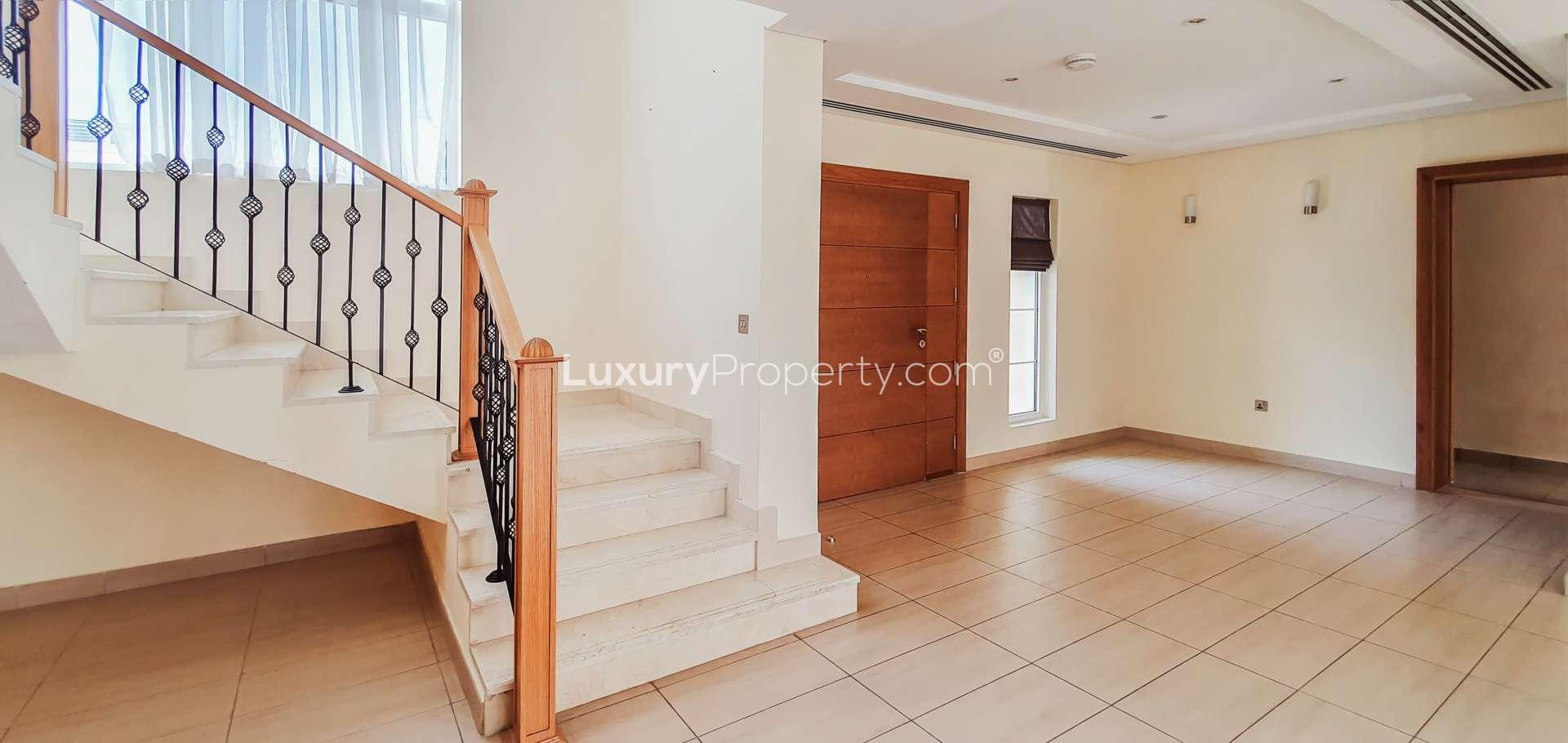 Interior view of spacious villa staircase and entrance in Jumeirah Park, Legacy Nova Villas