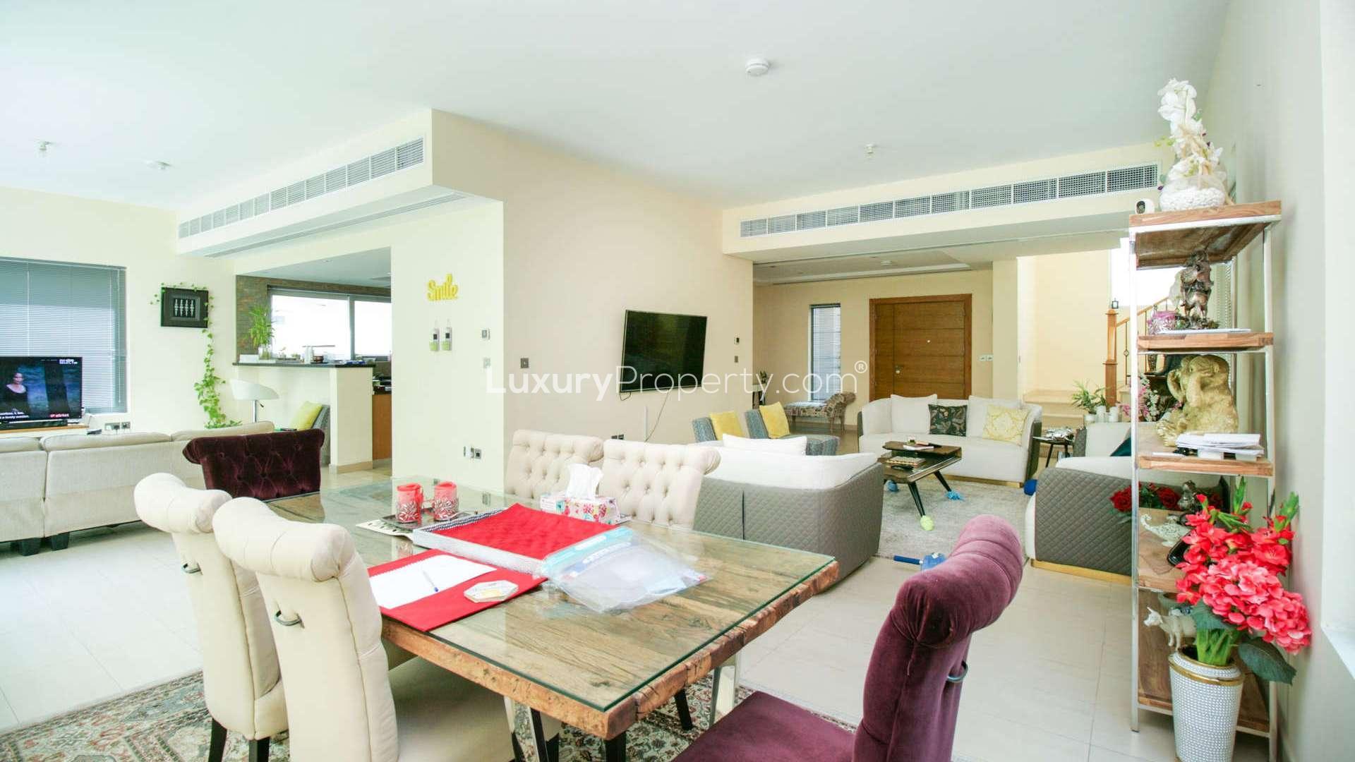 Spacious living room in Legacy Nova Villa, Jumeirah Park, with modern decor and seating