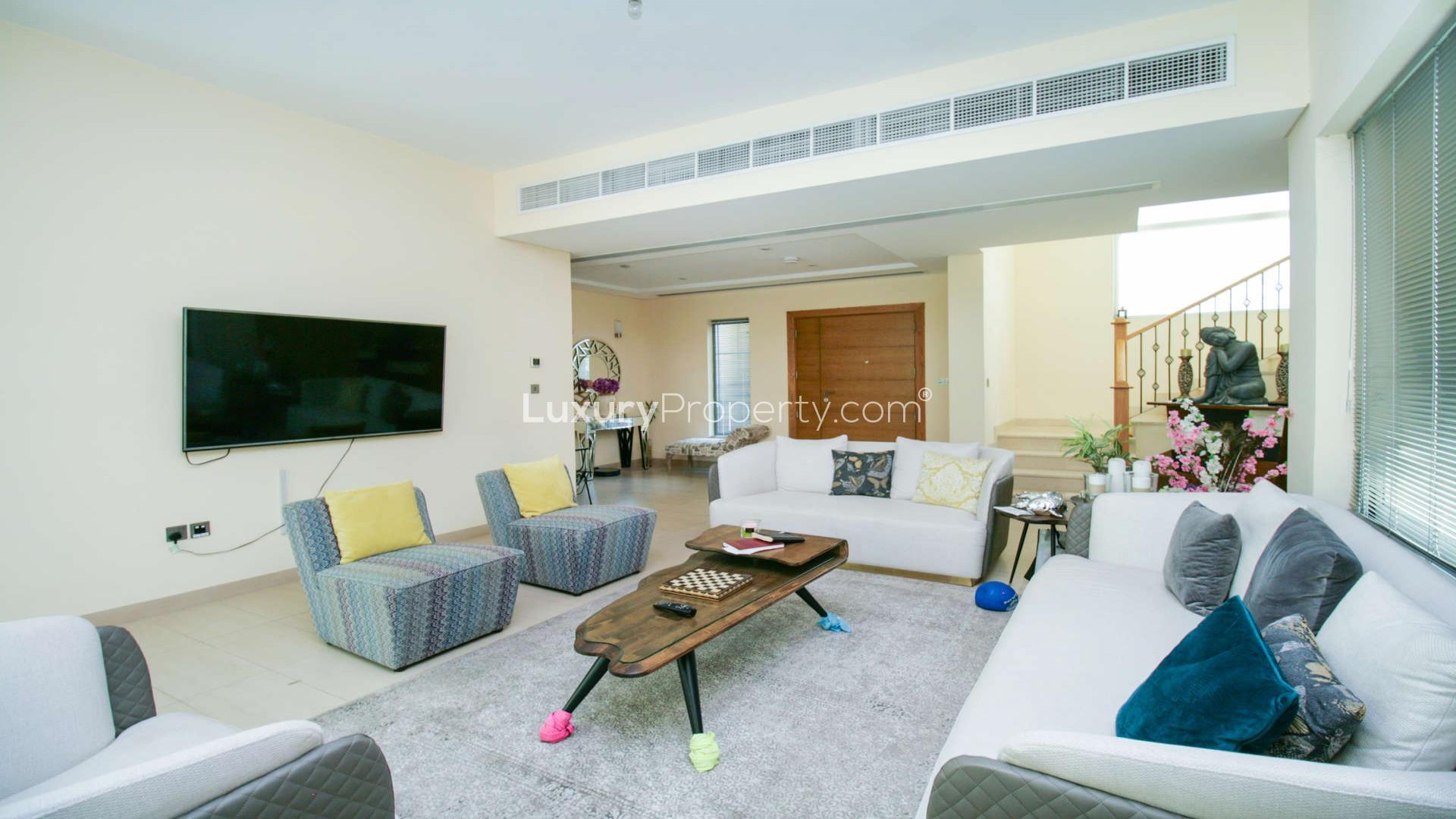 Bright living room in Legacy Nova Villa, Jumeirah Park with garden view