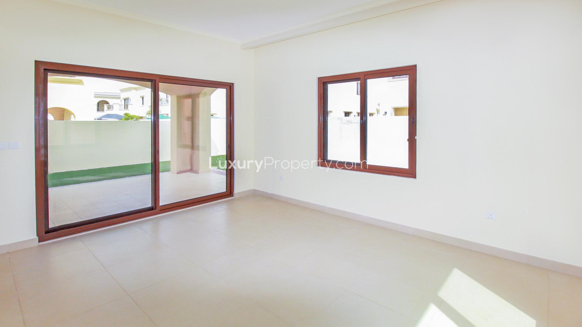 Bright living room with large windows in Lila villa, Arabian Ranches 2, available for rent