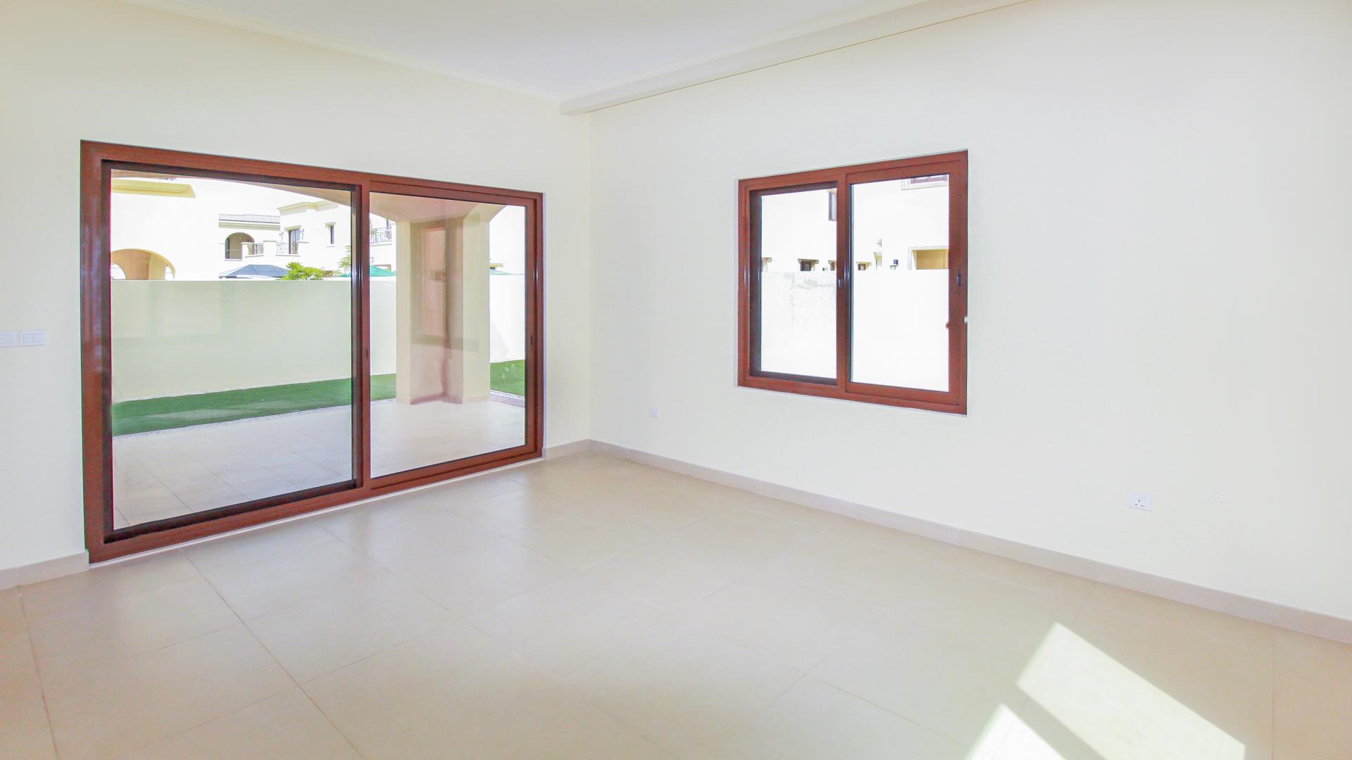 Bright living room with large windows in Lila villa, Arabian Ranches 2, available for rent