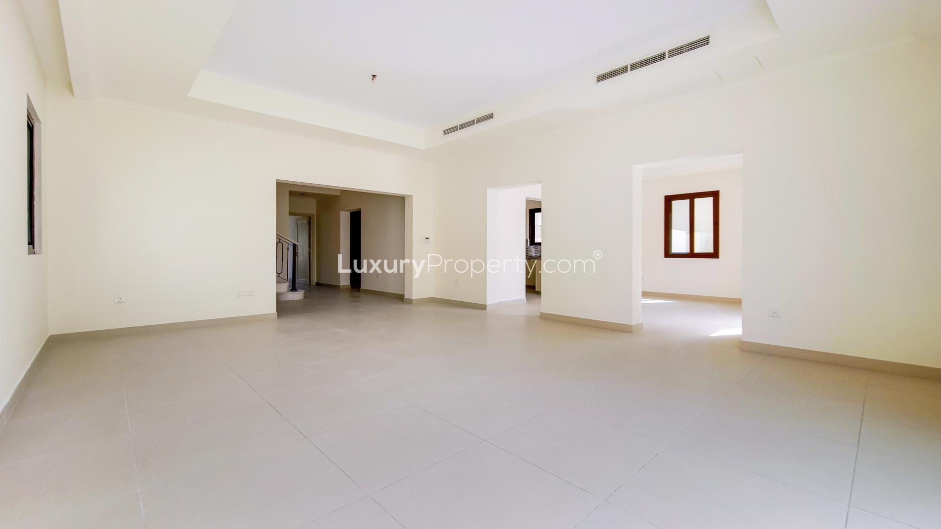 "Spacious living room with garden view in Arabian Ranches 2 Lila villa for rent.",Spacious living area in single row villa, Arabian Ranches 2, Lila, available for rent