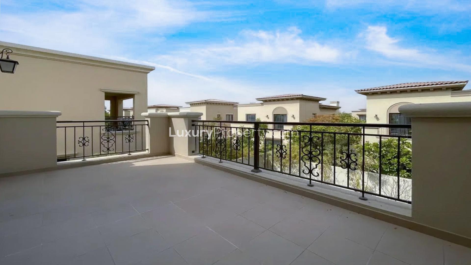"Spacious balcony view of 4-bedroom villa in Lila, Arabian Ranches 2 for rent.",Spacious living room in 4-bedroom villa, Lila, Arabian Ranches 2, with staircase view