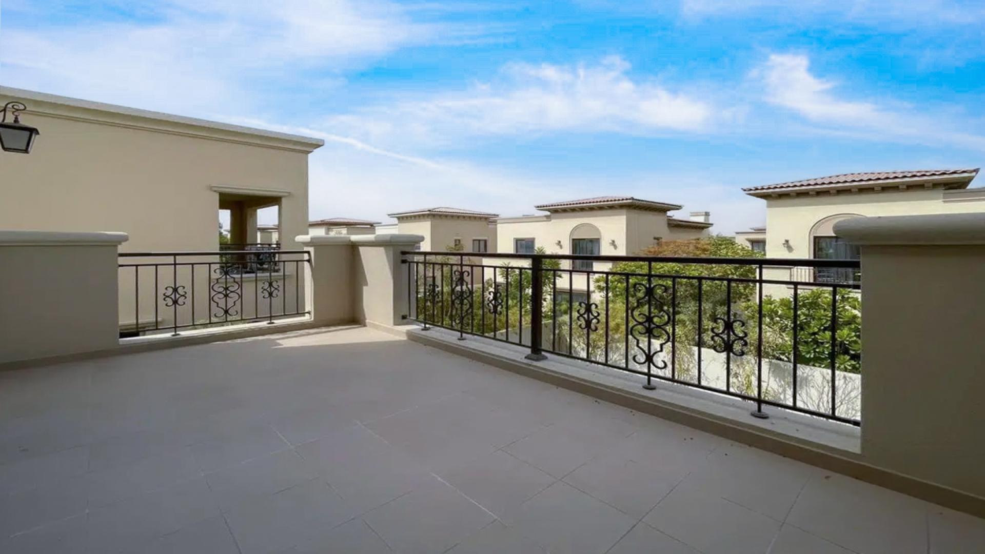 "Spacious balcony view of 4-bedroom villa in Lila, Arabian Ranches 2 for rent.",Spacious living room in 4-bedroom villa, Lila, Arabian Ranches 2, with staircase view