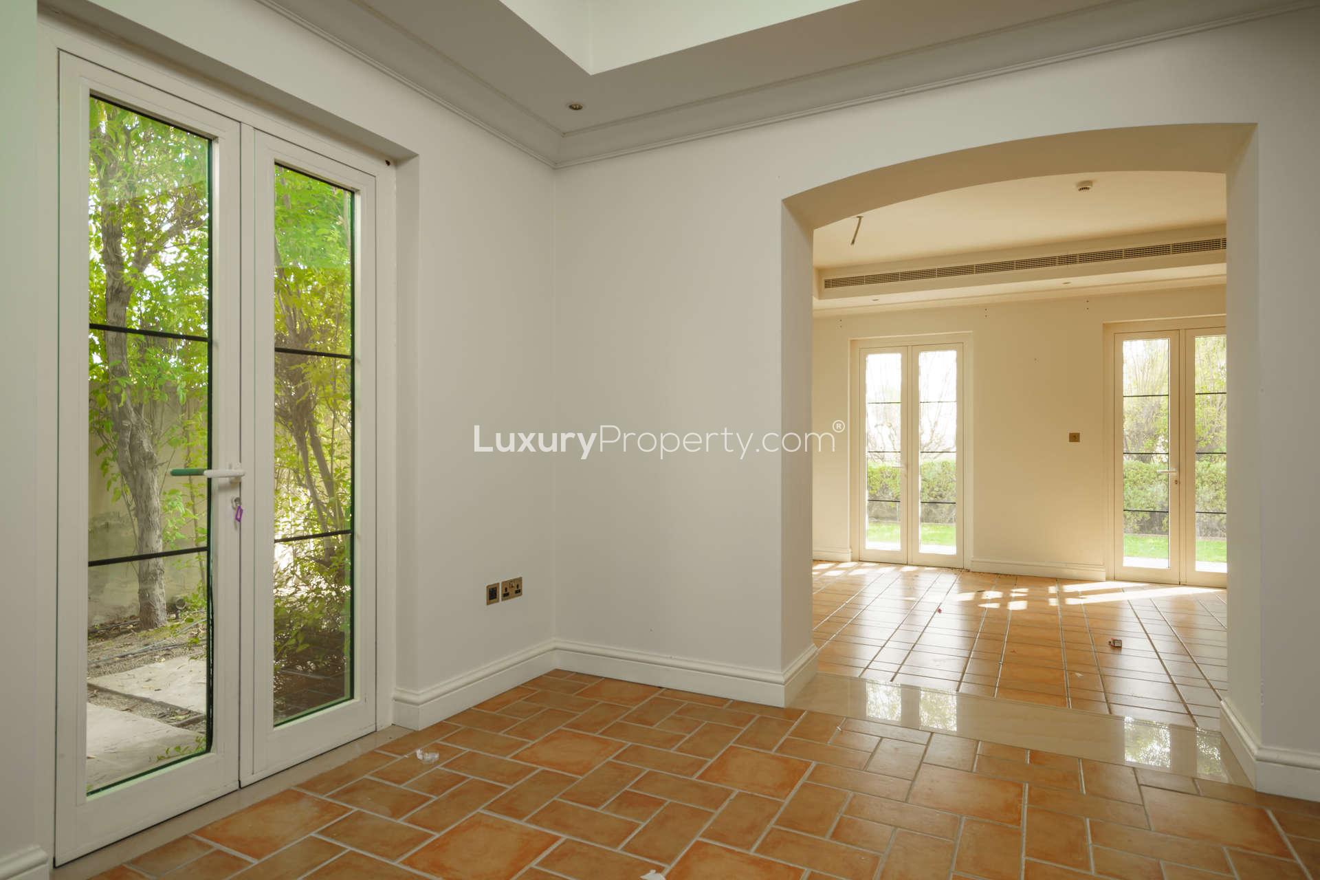 Spacious villa interior with natural light, tiled floors, and garden view in Lime Tree Valley