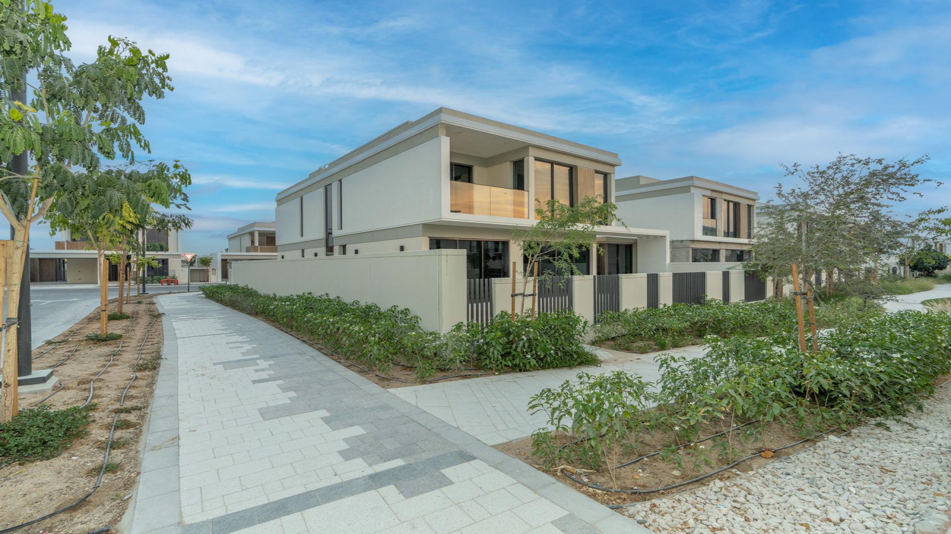 "Spacious living area with large windows in Tilal Al Ghaf villa, Harmony 3 community.",Private corner villa exterior in Tilal Al Ghaf's Harmony 3 community, near park